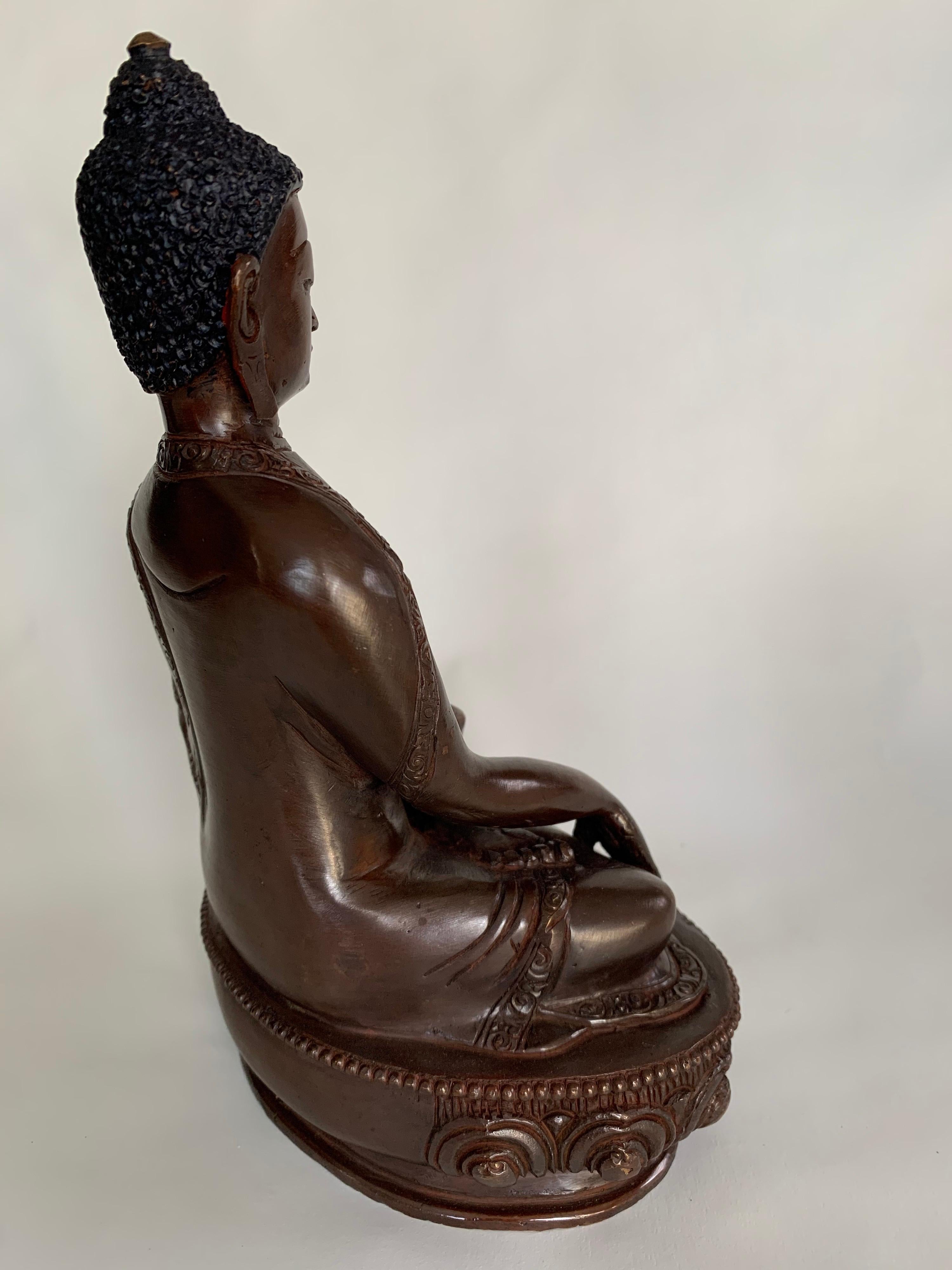 This statue is handcrafted by lost wax process which is one of the ancient process of metal craft. Buddha is seated on lotus in 