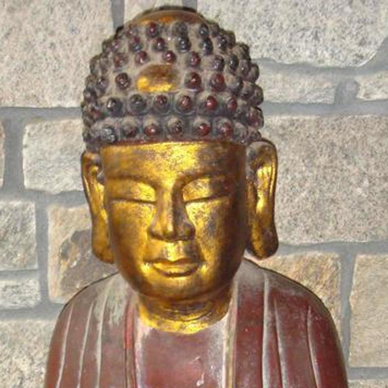 monk inside buddha statue