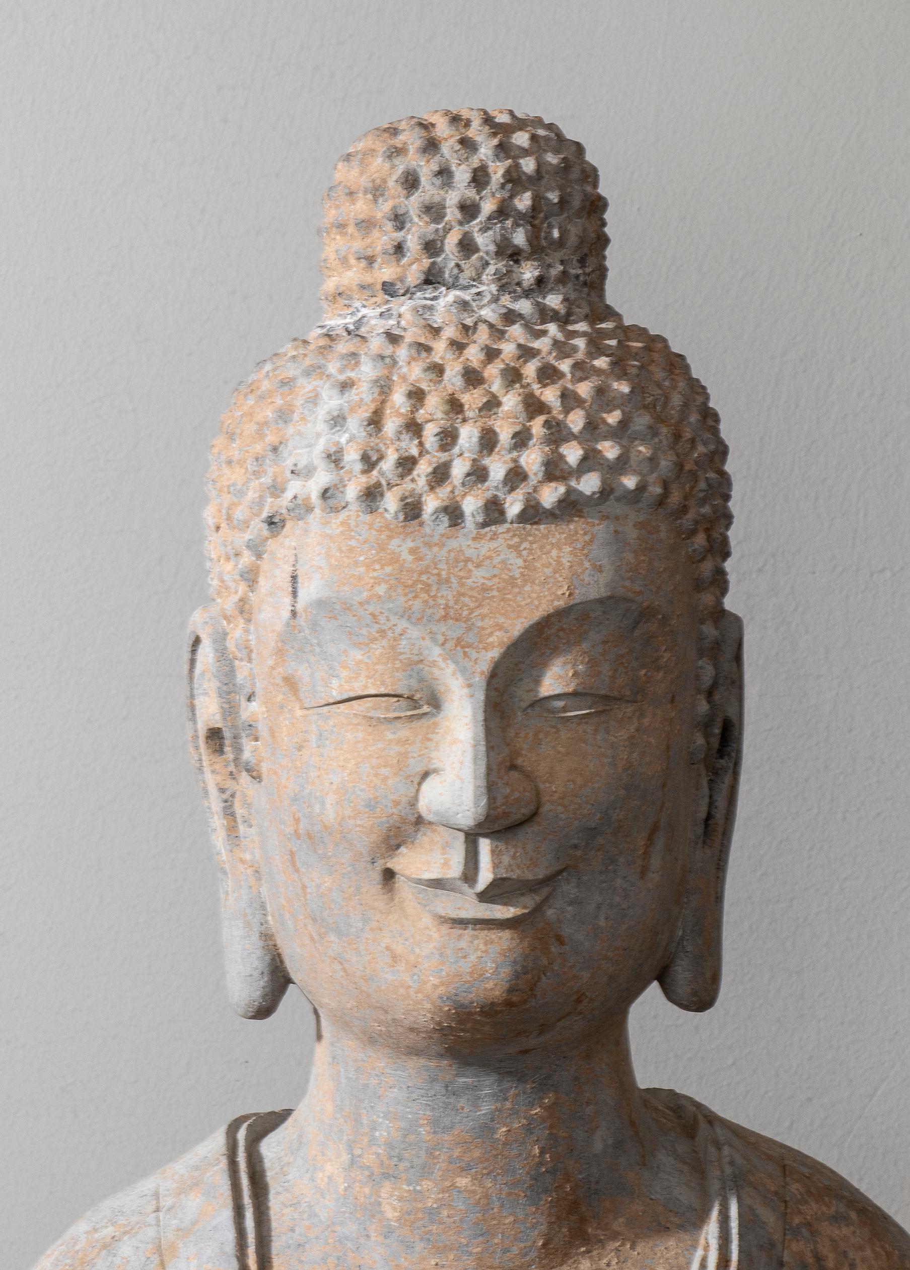 An impressive stone sculpture of Buddha In the style of the Tang and Wei Dynasties hand carved in the 20st Century.