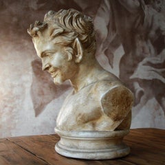 Bust in patinated plaster " terracotta style " 19th century with Louvre seal