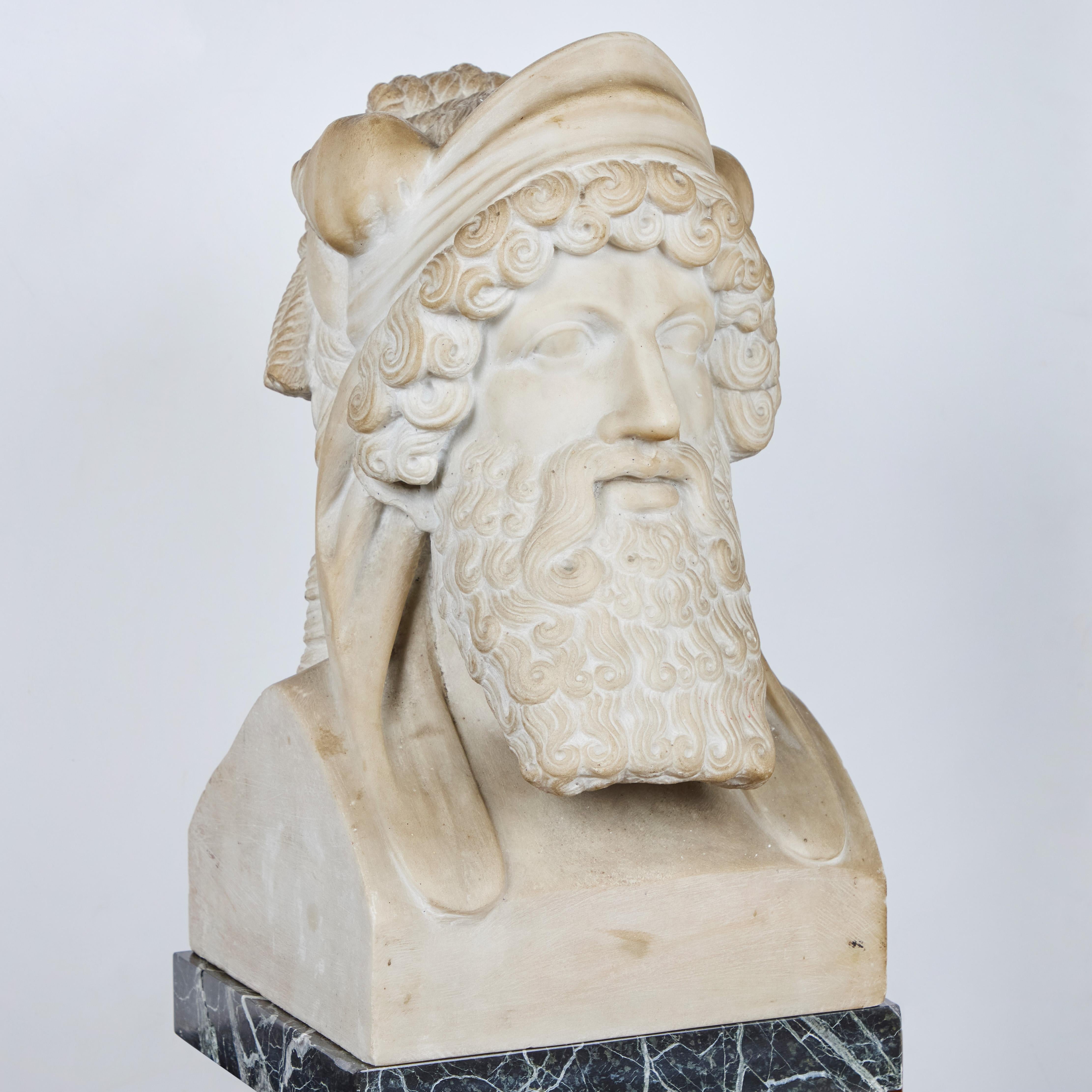 A spectacular, hand-carved Carrara marble double Janus sculpture.  
Note:  green marble showing in some detail images is from a pedestal and not part of the sculpture.