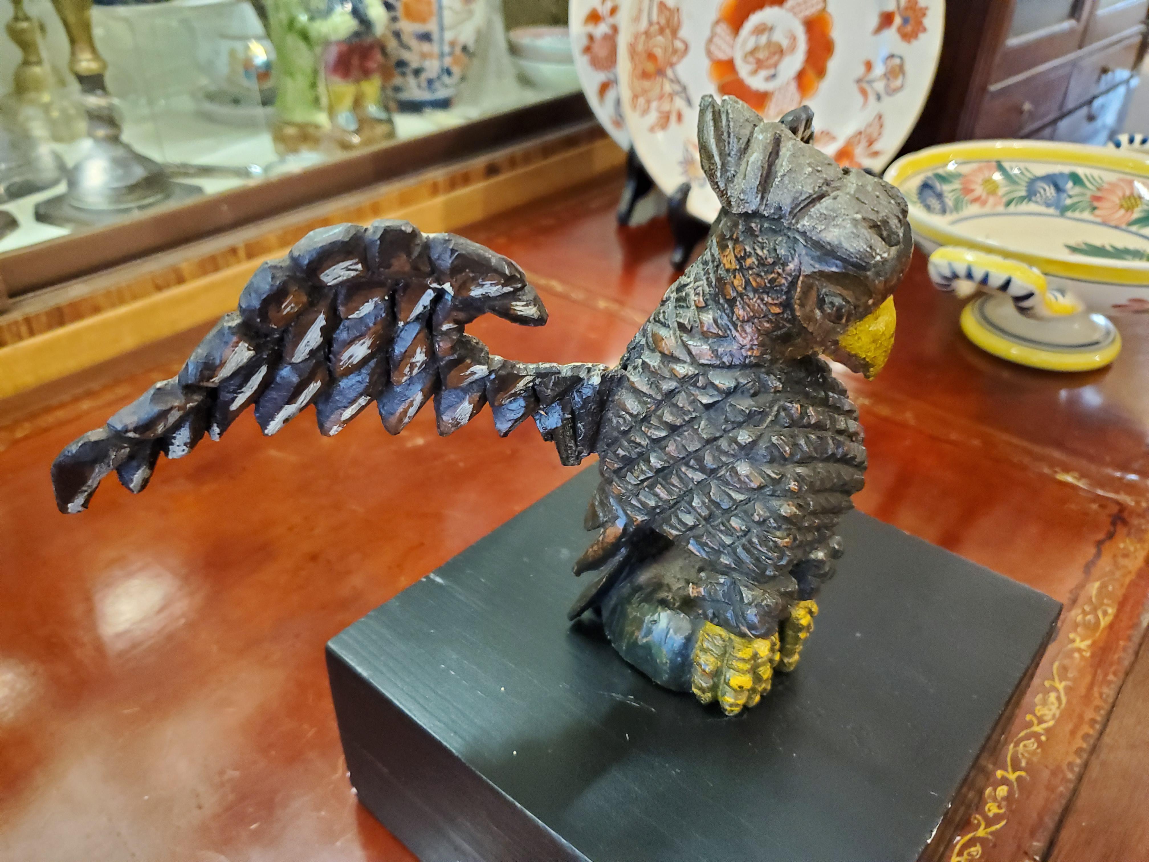 American Carved Folk Art Eagle made in the late 19th Century.

This carved wooden Eagle 11.5 inches wide by 6.5 inches deep by 9.5 inches tall including the later base.

Resembling a Schimmel but not attributed to the maker. 

This is a carved and