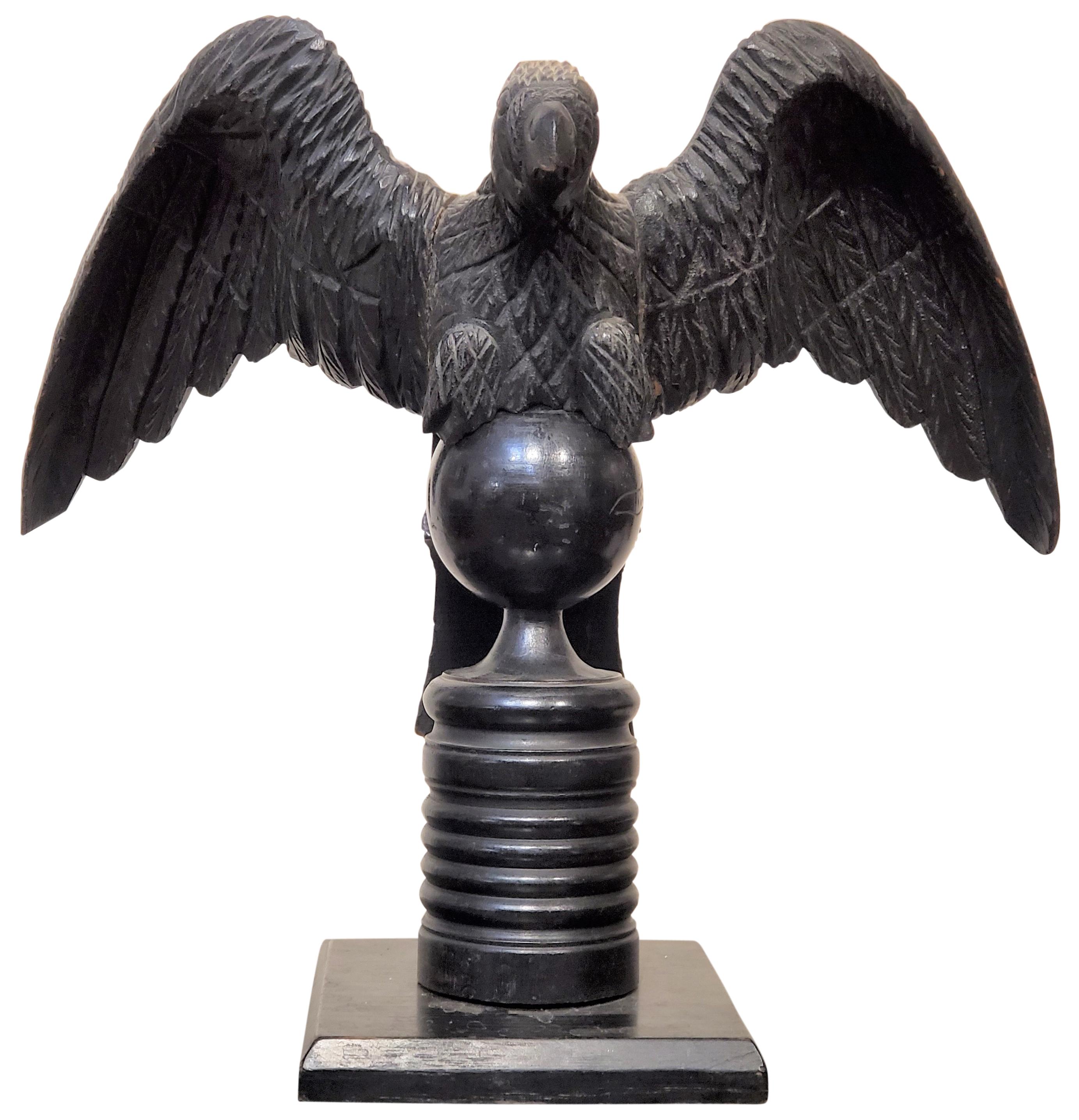 Carved and Ebonized Statue of an Eagle