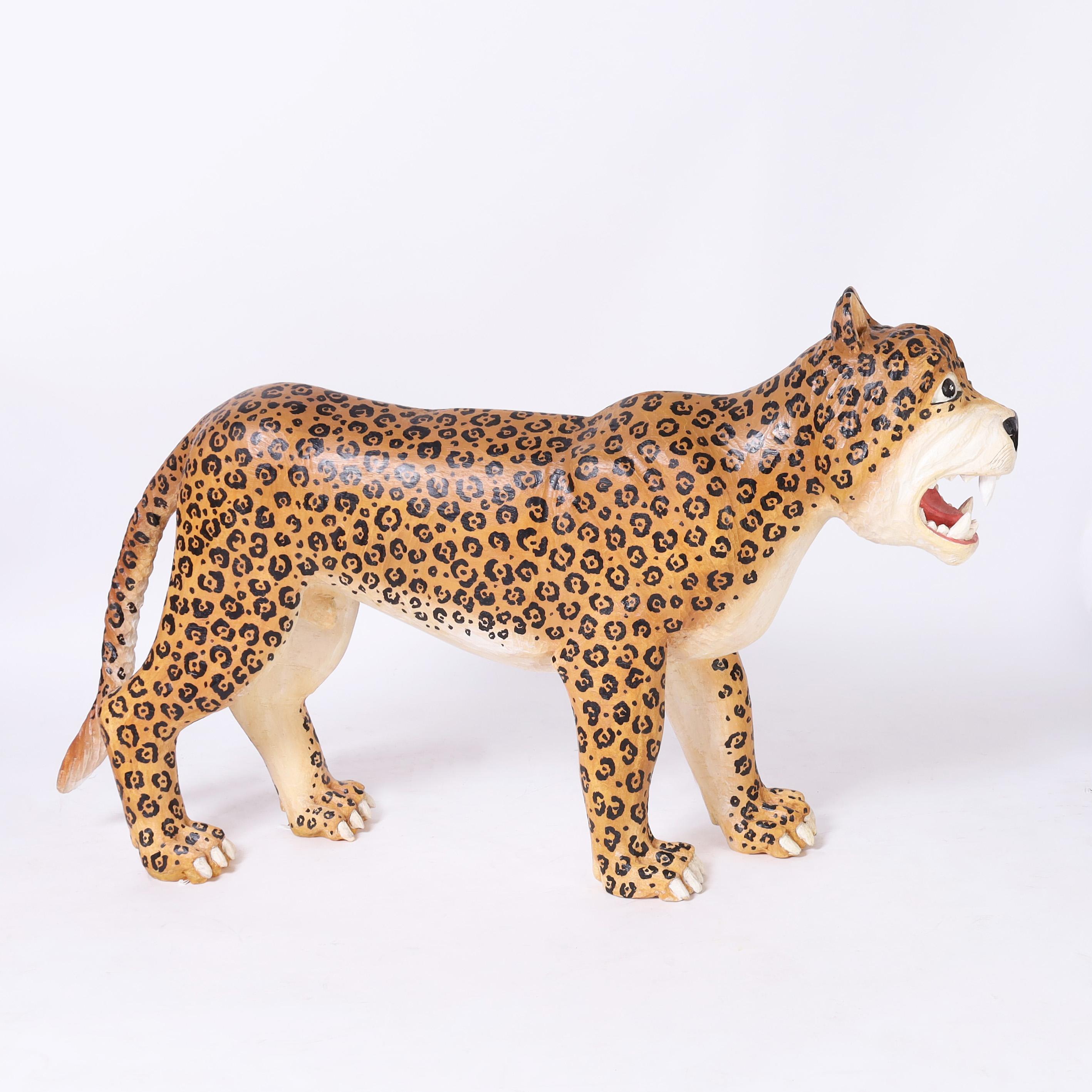 Standout whimsical vintage life size hand carved jaguar decorated with its distinctive rosettes in a faux fierce expression.