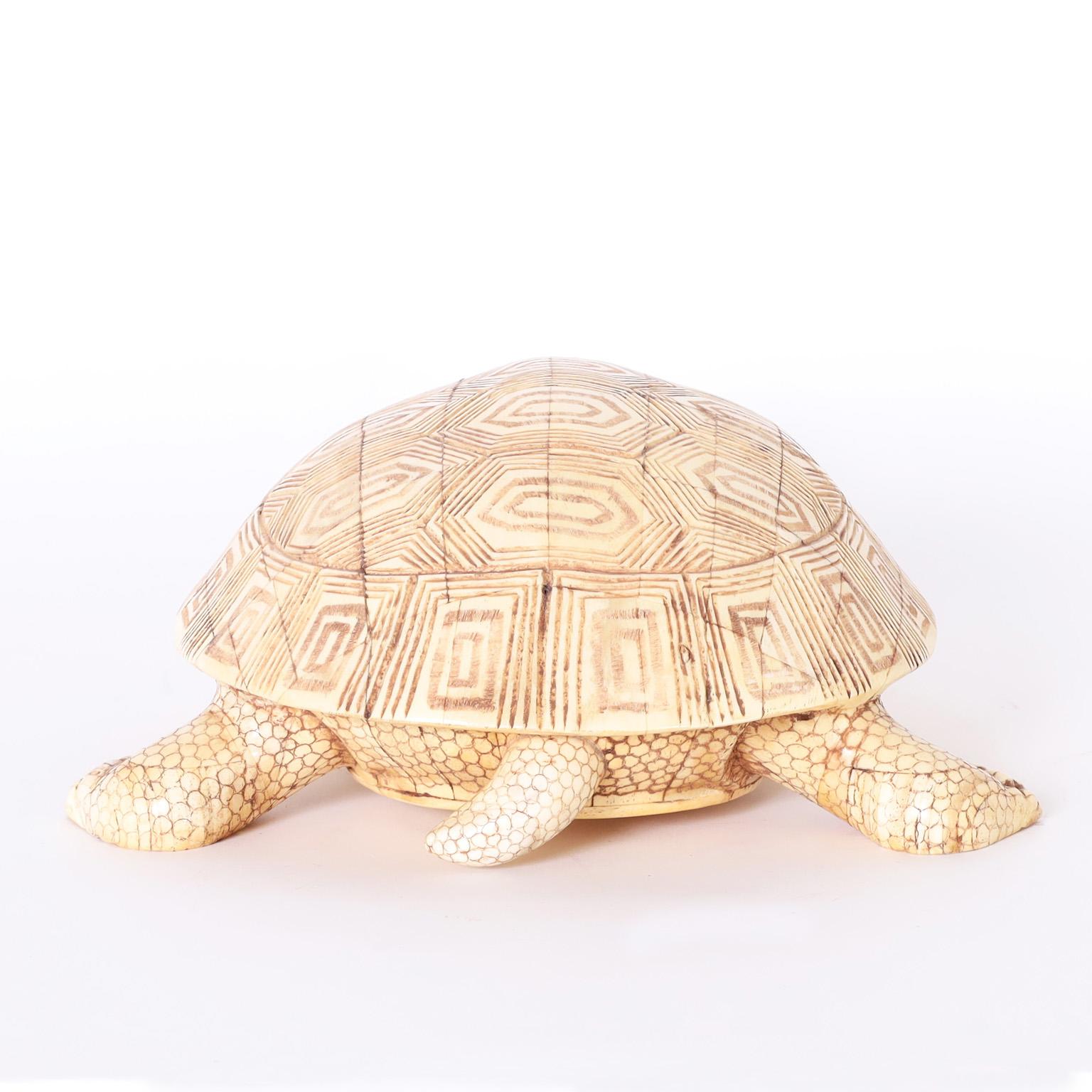 Whimsical turtle sculpture or object of art crafted in carved bone with an organic palette and amusing stylized form.