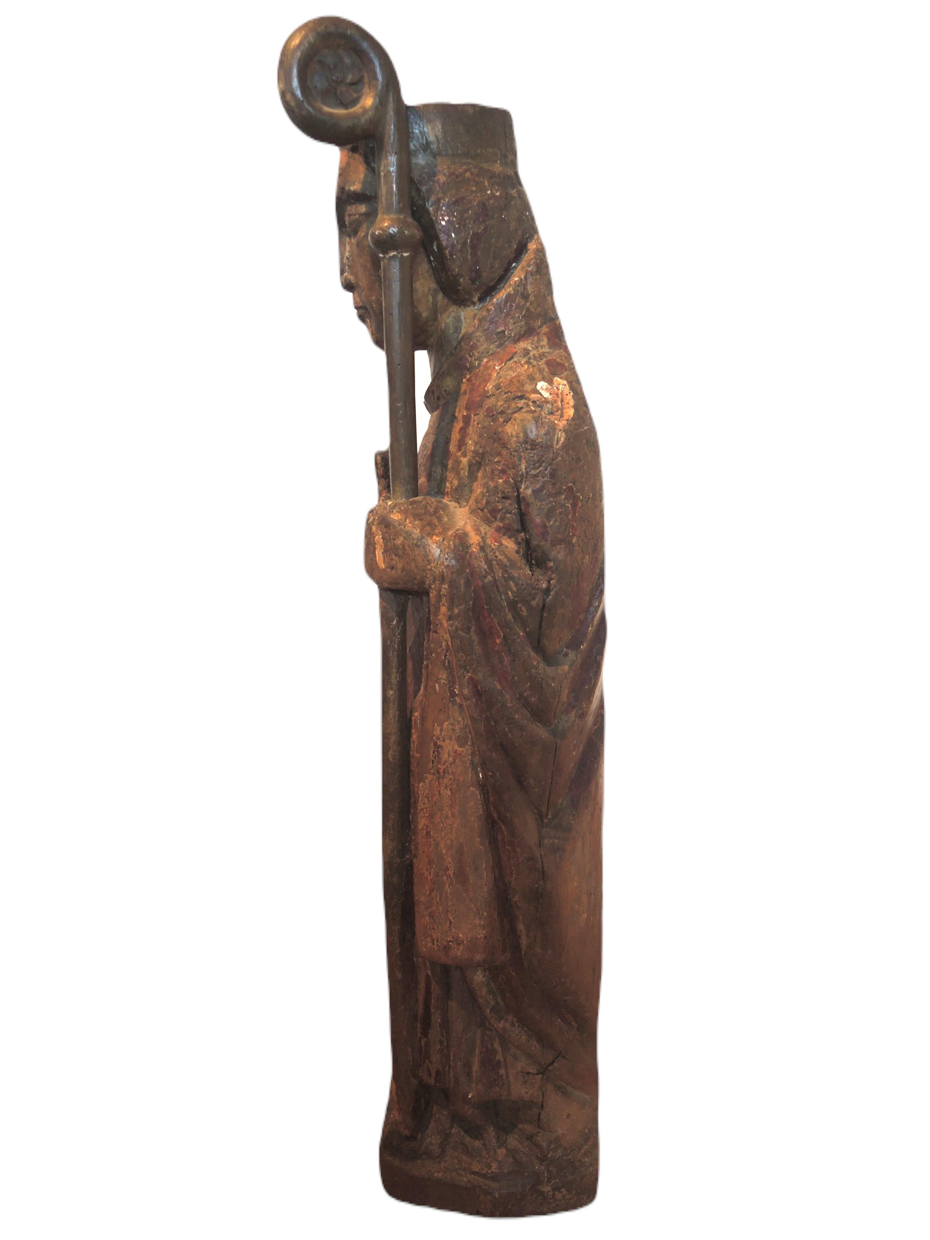 Catalan School of the 13th century. Wooden Bishop - Brown Figurative Sculpture by Unknown