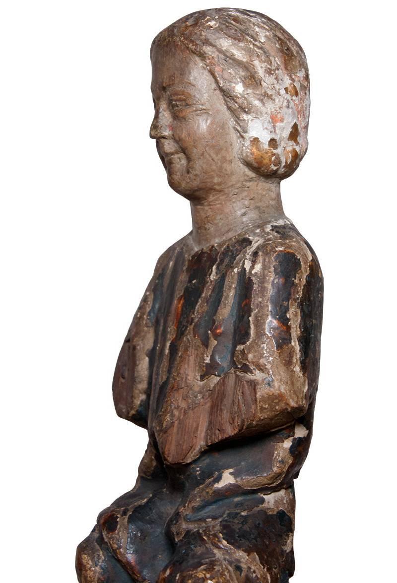 Child Jesus in painted and gilt wood, 13th century - Brown Figurative Sculpture by Unknown