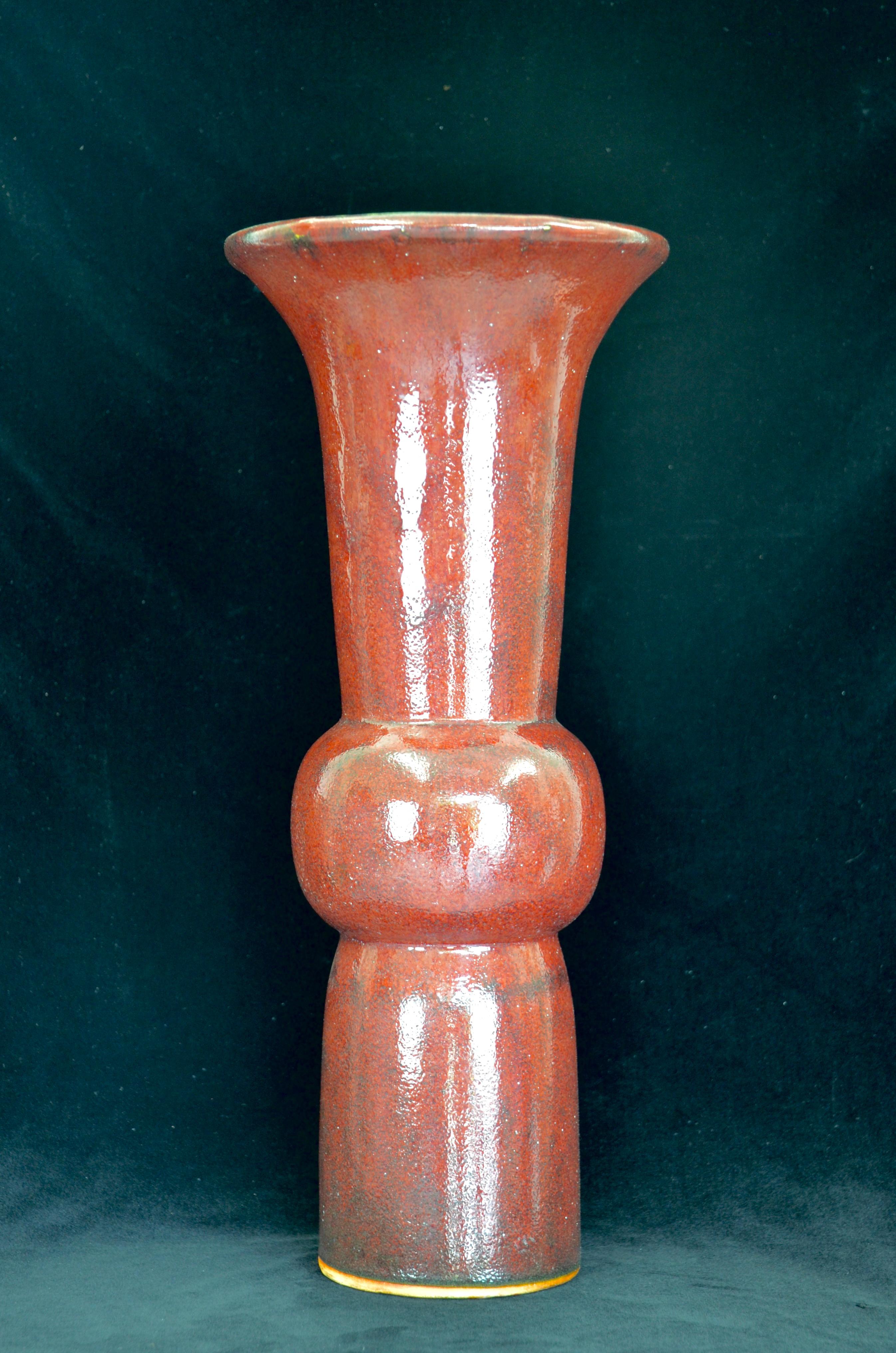 An early 20th century Chinese Sang de Beouf Gu Form Vase. The term 