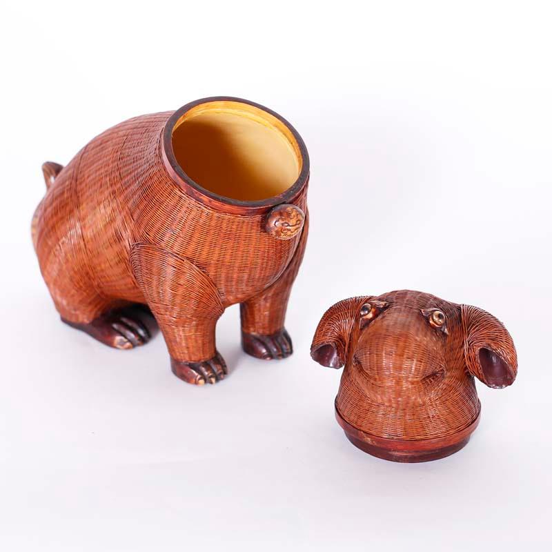 Mid century Chinese puppy box from the Shanghai collection ambitiously crafted in bamboo wicker with carved wood feet and tail.