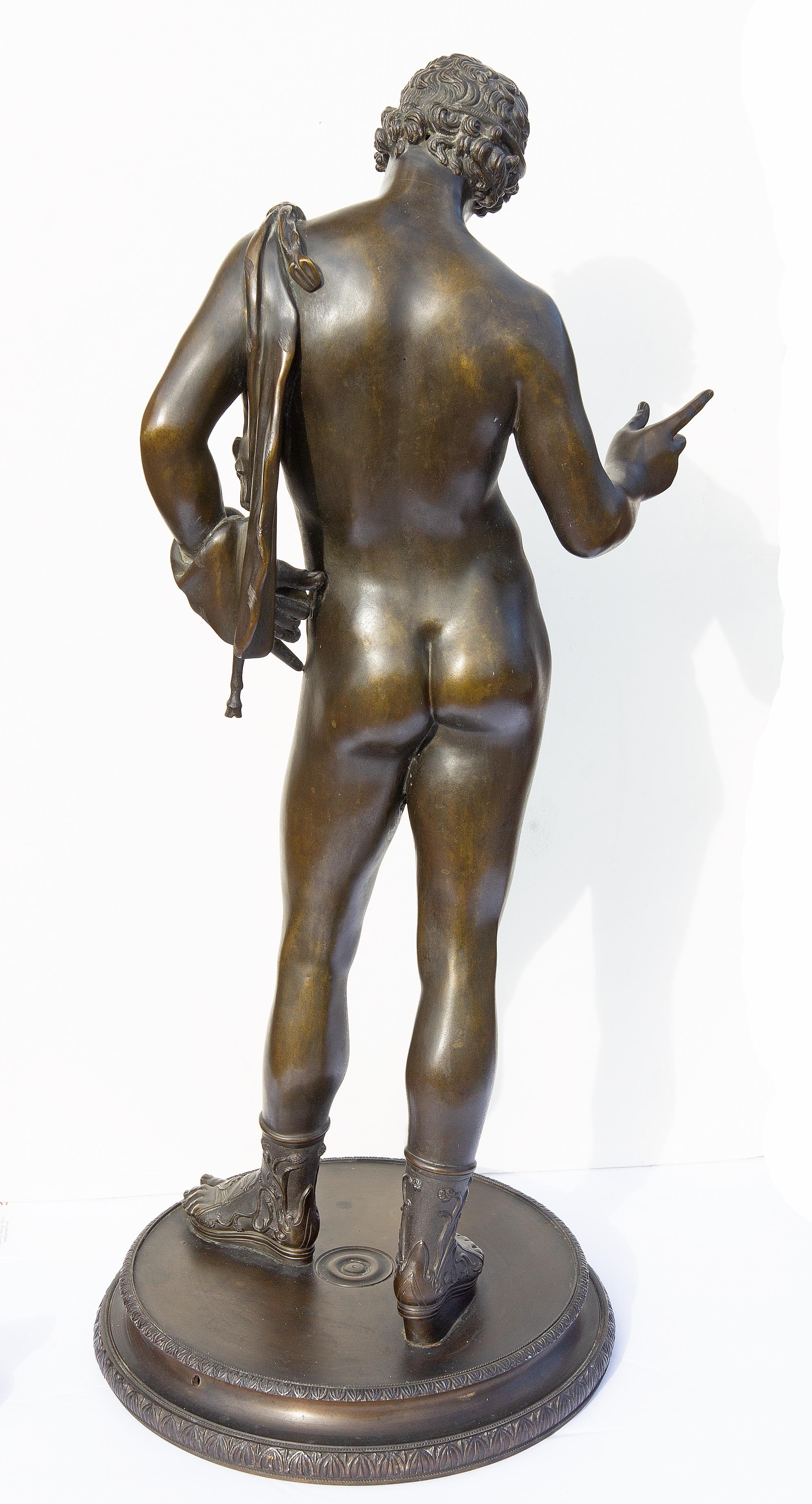 Grand Tour 19th century bronze sculpture of Narcissus after the original found in 1862 at Pompeii. When first found in Pompeii it was identified as Narcissus. Years later it was identified as Dionysus. Excellent quality.