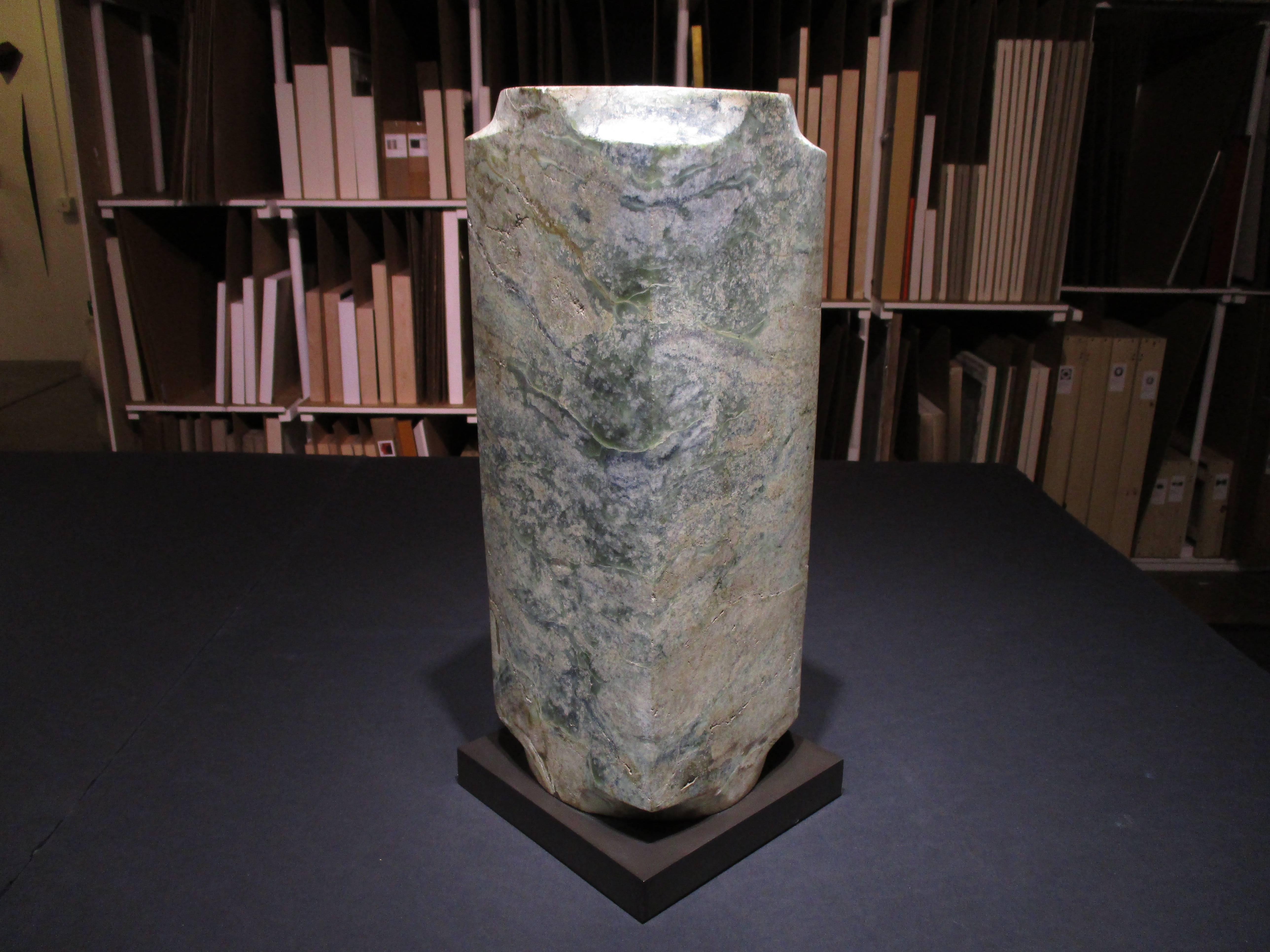 pale jade with dark green and brown areas, Qijia Culture (2200 - 1700 BCE)

As early as 7,000 years ago, the Chinese used jade to fashion symbolic weapons, body ornaments, and ritual objects. Jade is valued for its extreme durability, color,