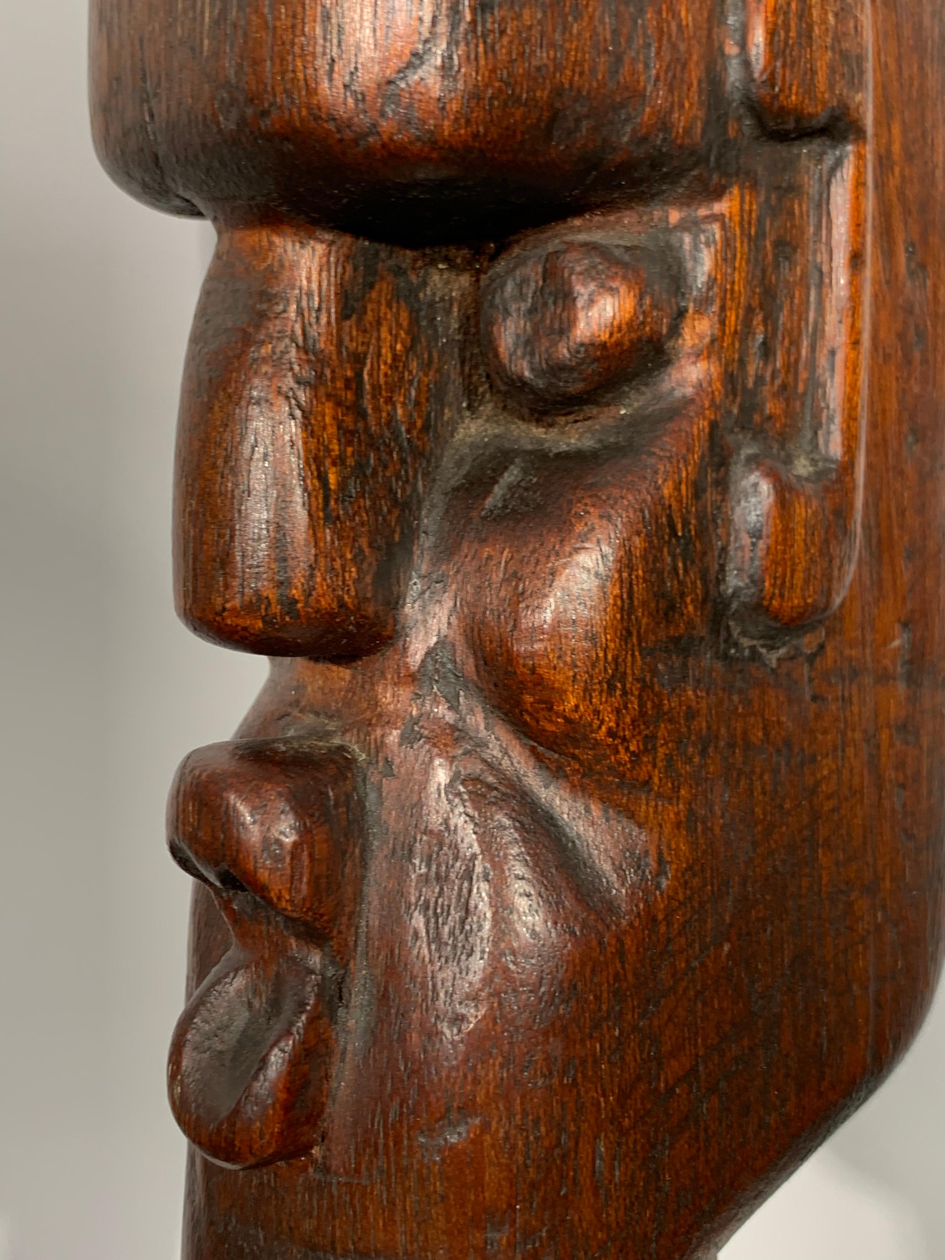 Stunning Cubist bust dating from Art Deco era. Carved mahogany, measures 13.75 inches (h), 2.5 inches (w), 4.5 inches (d).  Unsigned and unattributed. Excellent condition with original surface patina. 