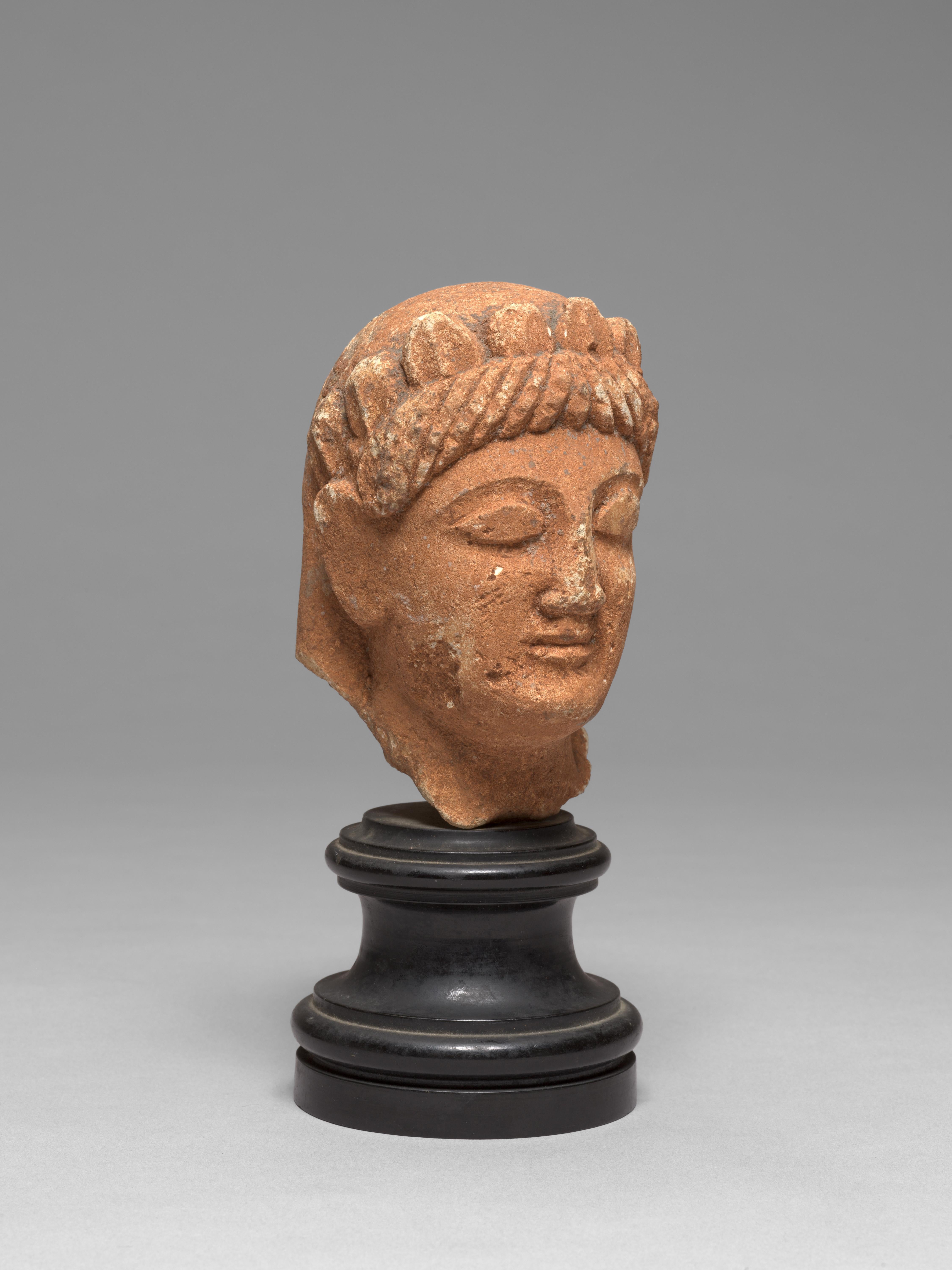 ANCIENT CYPRIOT LIMESTONE HEAD OF A VOTARY, ARCHAIC PERIOD LATE 6TH CENTURY - Sculpture by Unknown
