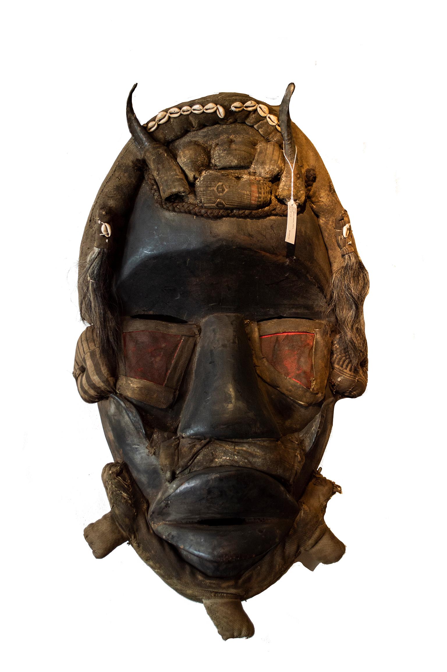 Unknown Figurative Sculpture - "Dan Mask, " Carved Wood created in Liberia circa the 1950s