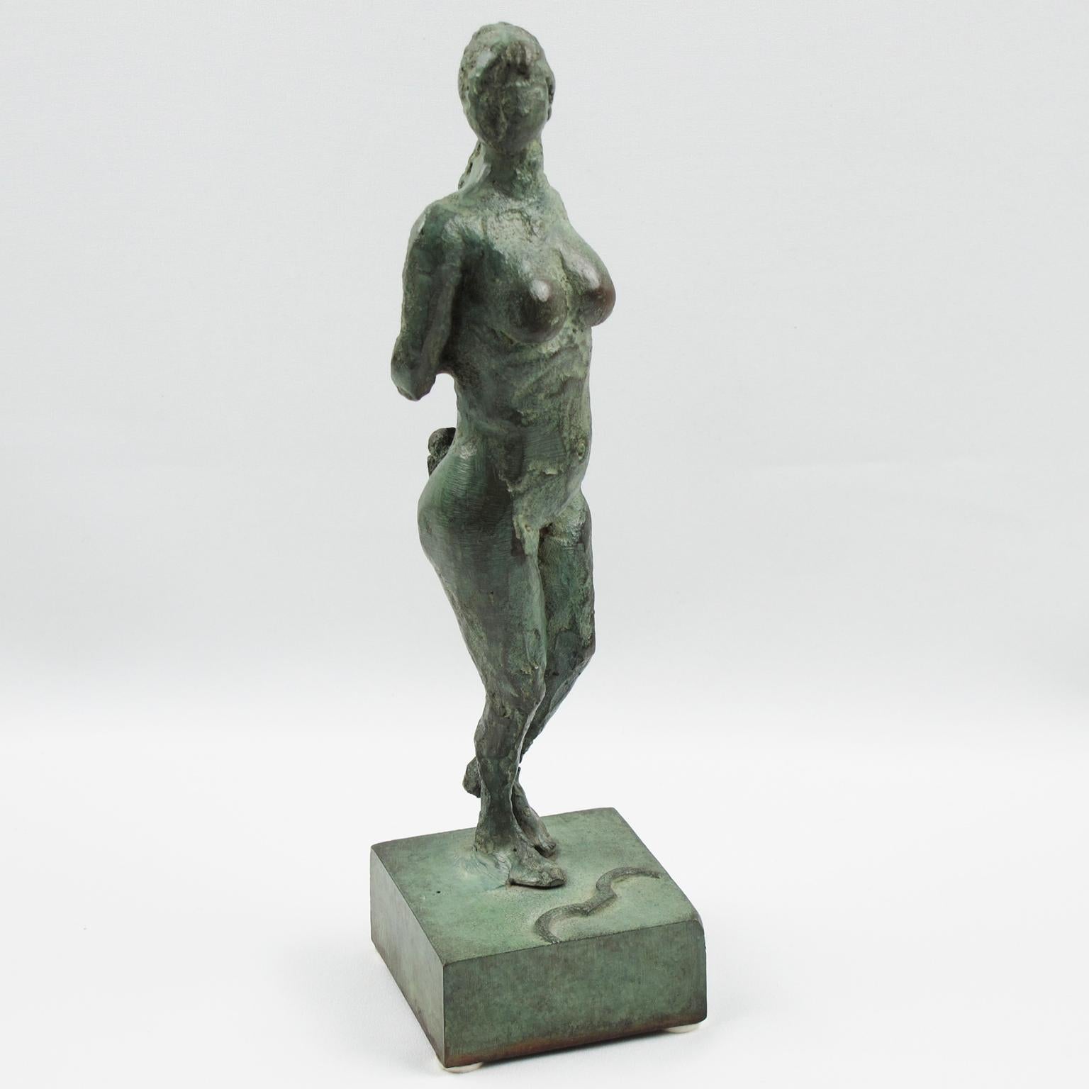 This is a stunning French Art Deco bronze sculpture figurine. The statue features a stylized freestyle interpretation of Artemis or Diana the Huntress (Diane Chasseresse). The nude female has a handmade feel textured pattern design with both arms