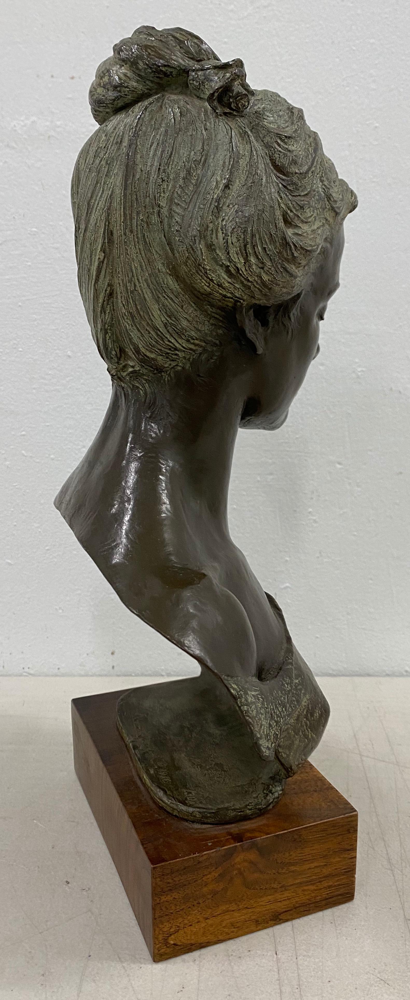Early 20th Century Bronze Bust of an Elegant Young Woman C.1916 - Gold Figurative Sculpture by Unknown