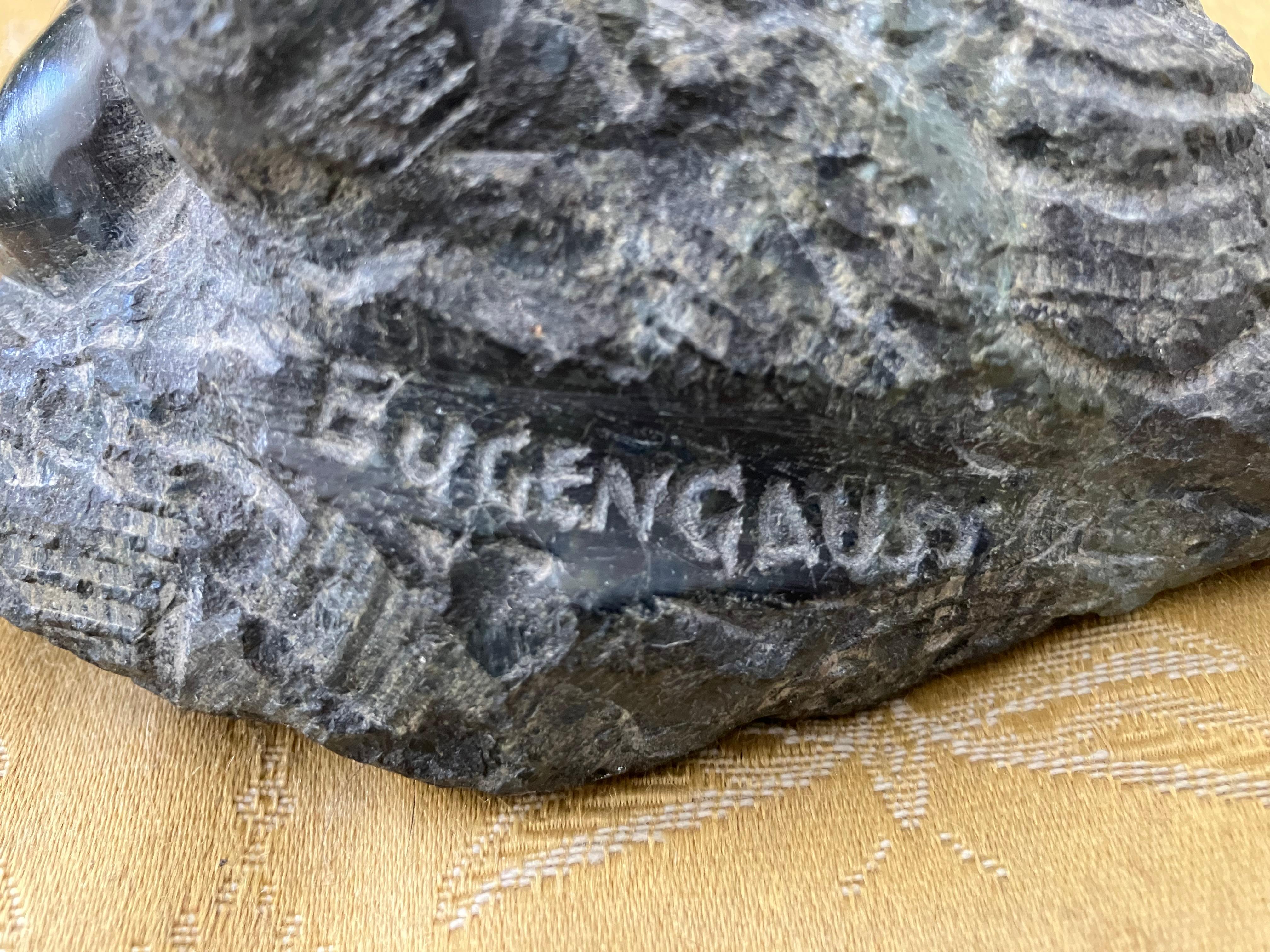 Eugene Gauss: 1905-1988. Well listed American sculptor who has Auction results as high as $13,200. He exhibited at the Pennsylvania Academy for fine arts as well as the national Academy of design. This beautiful granite sculpture of a man and a
