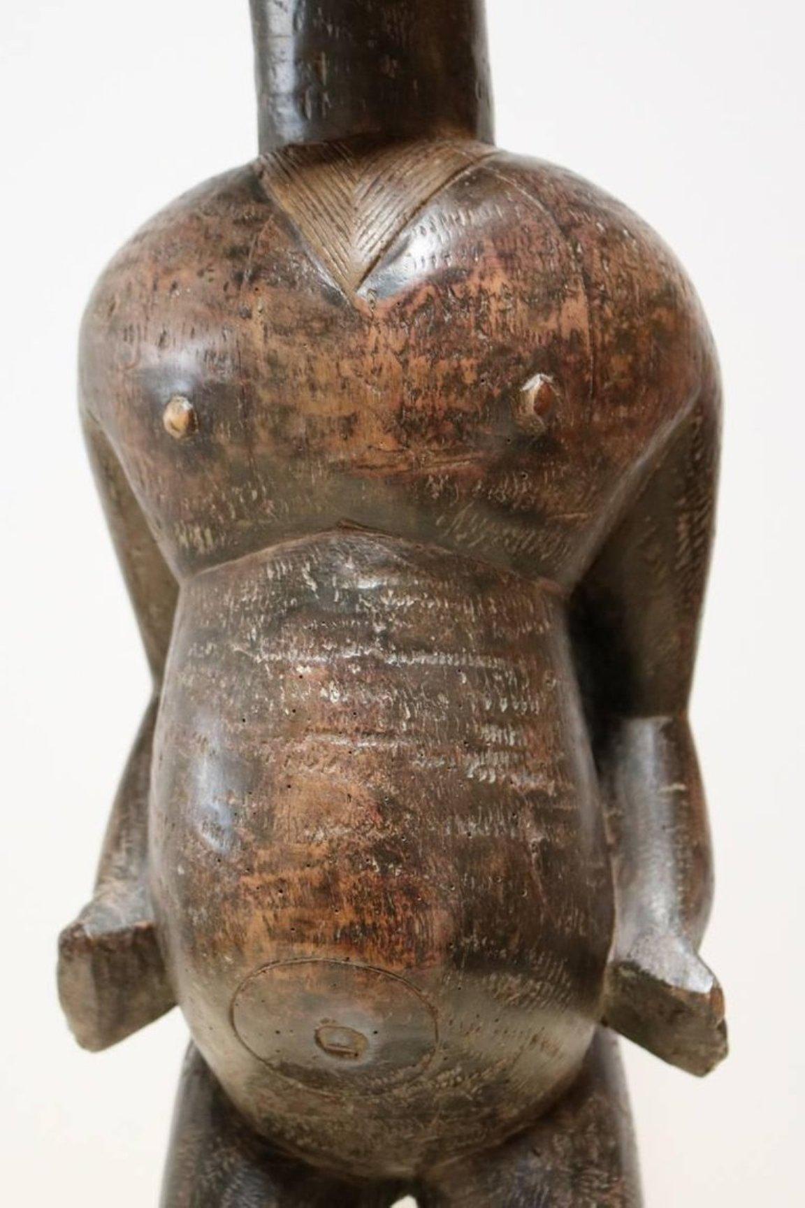 Carved wood figure by West African Lobi People.


