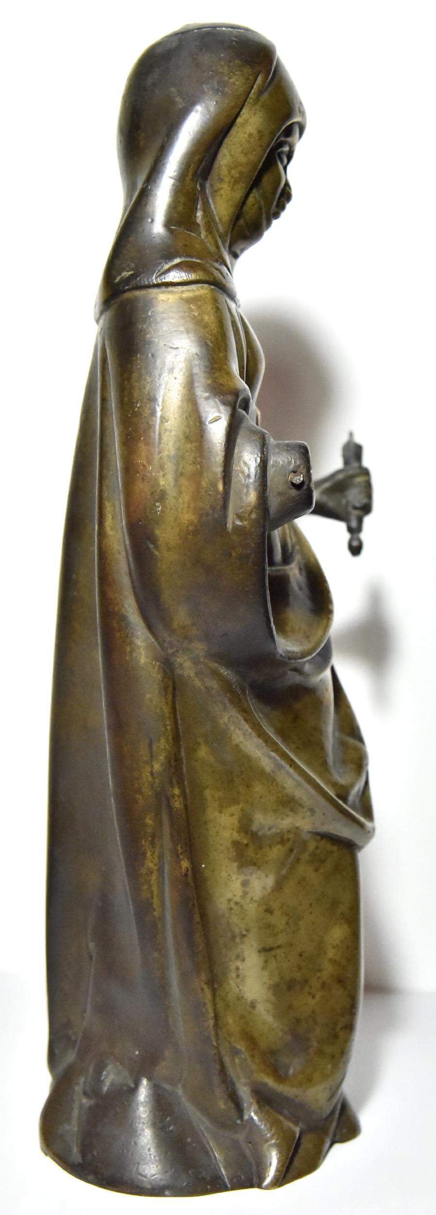 
Bronze Saint figure from the late fifteenth or early sixteenth century, Southern Netherlands perhaps Dinant

This large bronze figure is built in three parts, on the one hand the body of the saint, and on the other hands, secured by rivet. The left
