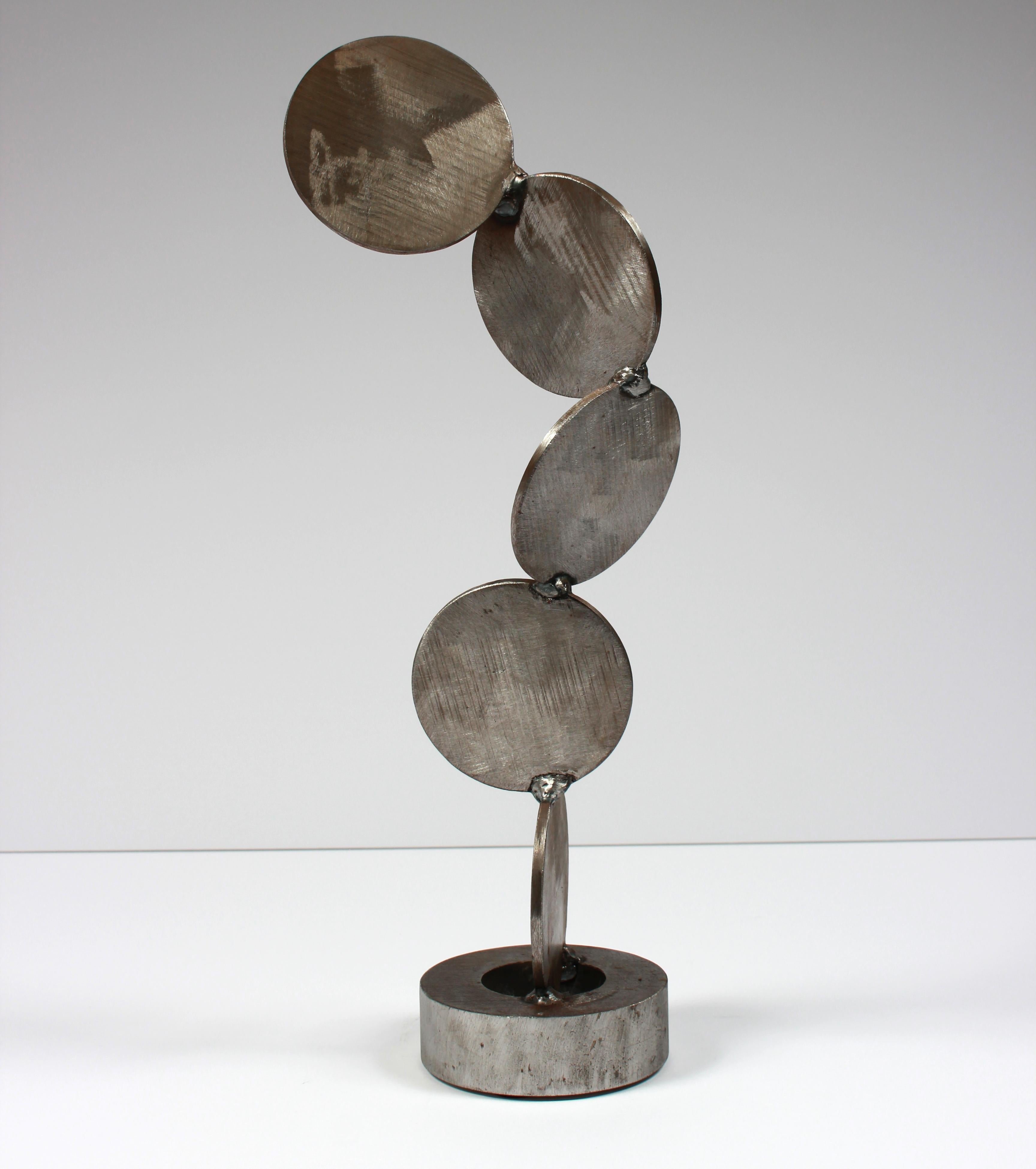 This late 20th century welded steel geometric abstract sculpture stands on its own and is unsigned.  Purchased from a collector and part of a larger body of sculptural work.