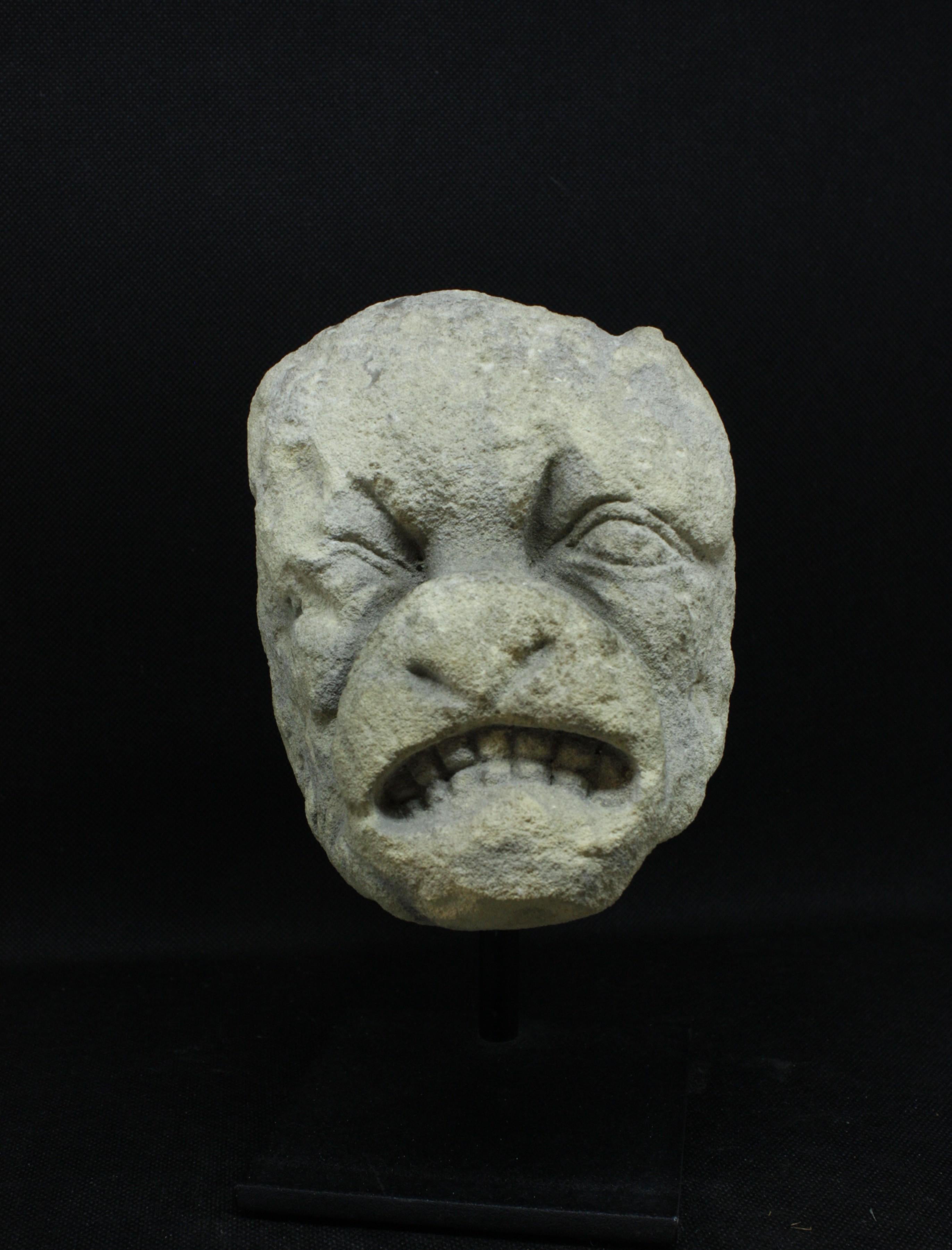 14th-century Gothic gargoyle in limestone