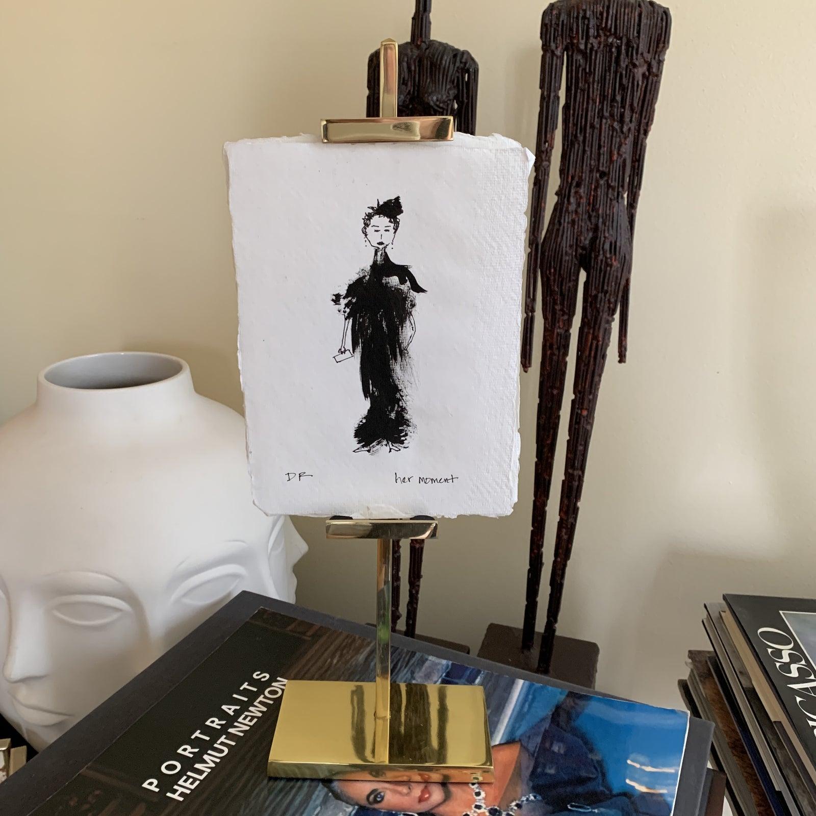 New! The gallery has several available for purchase. Holds small art. Shiny gold brass metal adjustable easel.
