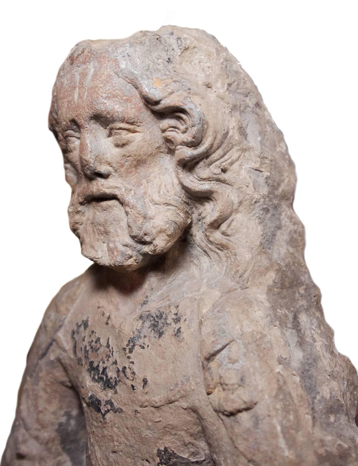 High relief depicting a seated prophet, XIV th century - Gray Figurative Sculpture by Unknown