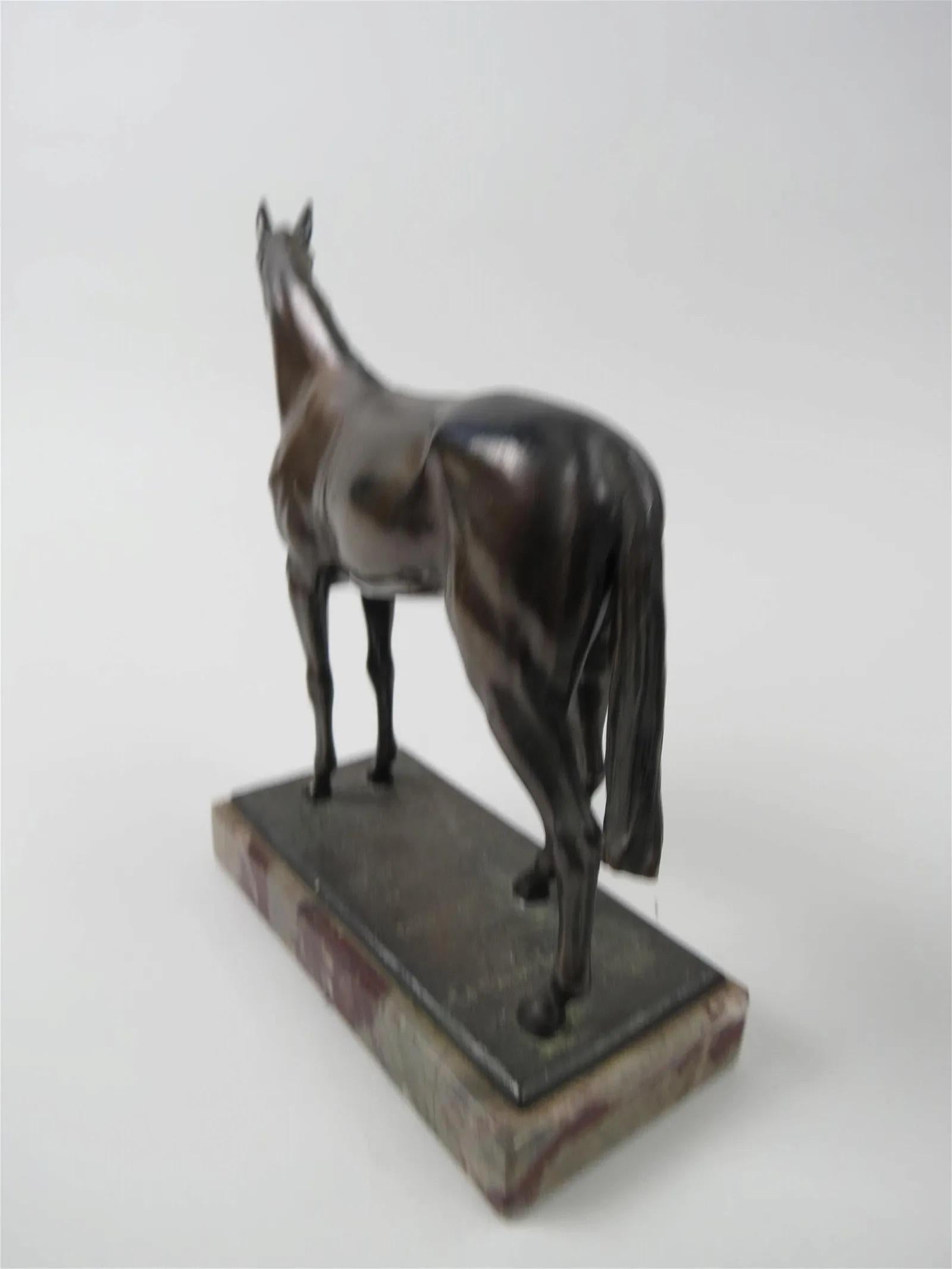 Figure of a horse , French 1940's , on a marble base
appears unsigned 
finely carved, beautiful rendering, nice patina