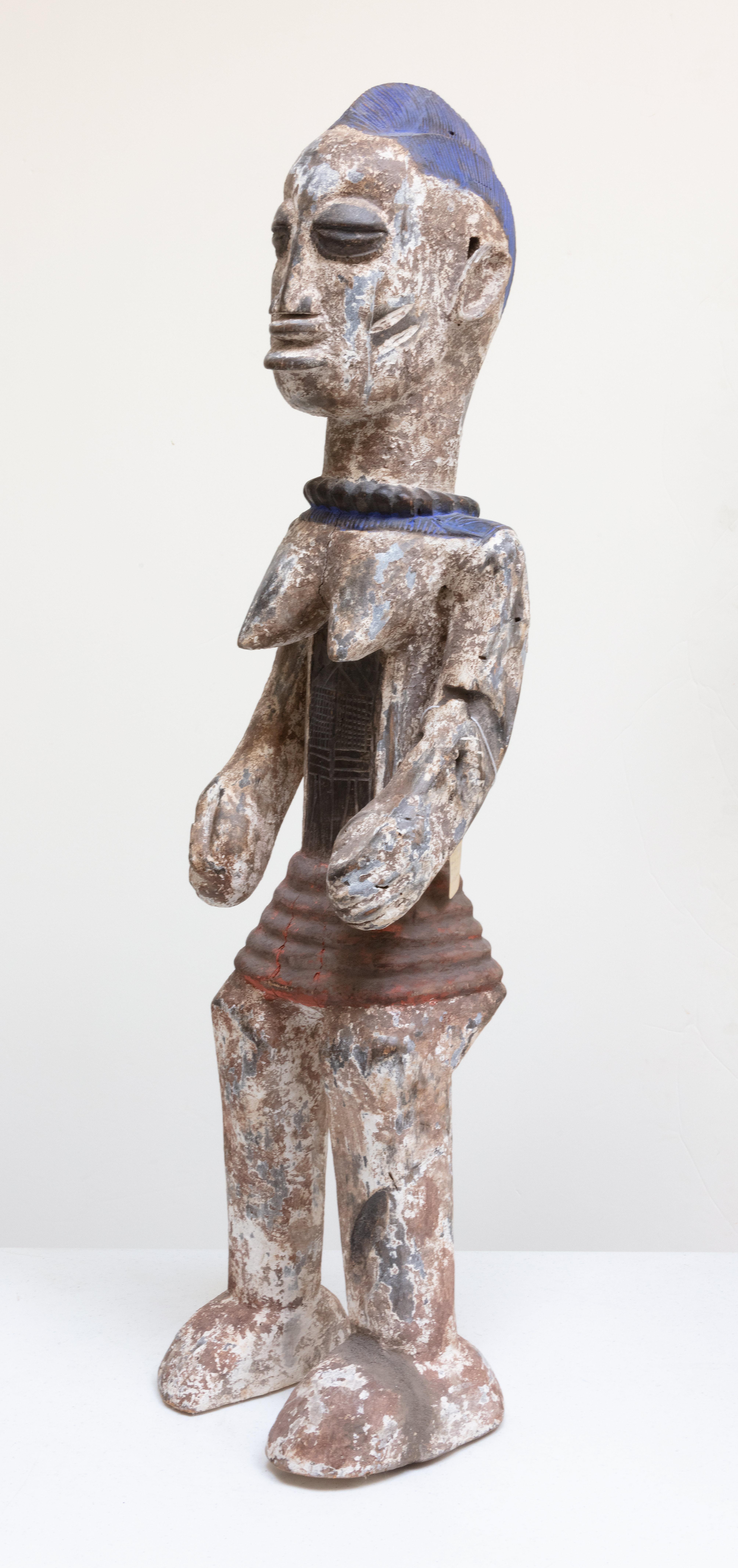 Unknown Figurative Sculpture - "Idgo Nigeria Female Standing, " Wood Statue with Blue & White Pigment circa 1930