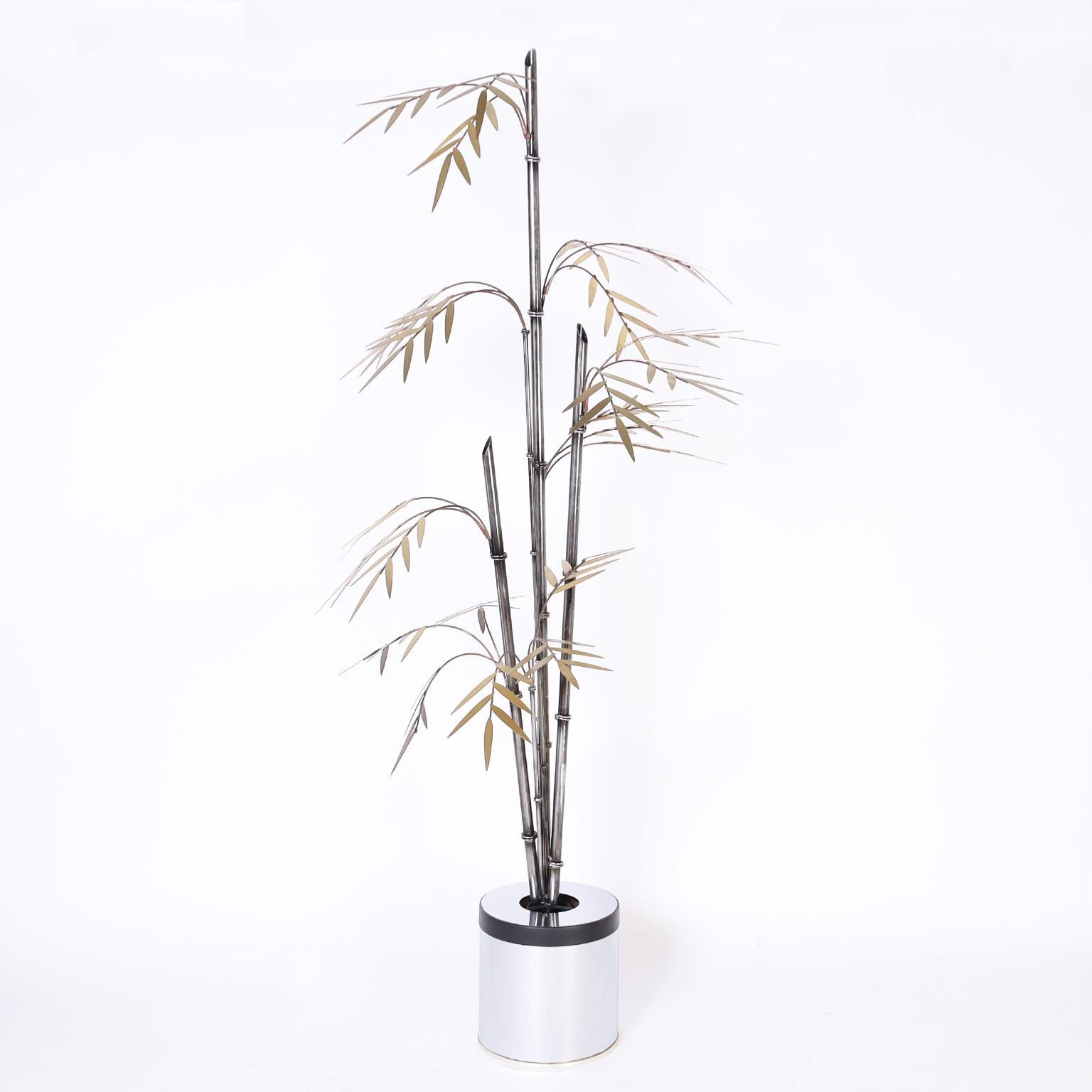 Mid century bamboo sculpture hand crafted with metal faux bamboo stems and copper and brass branches and leaves illuminated from the canister base.