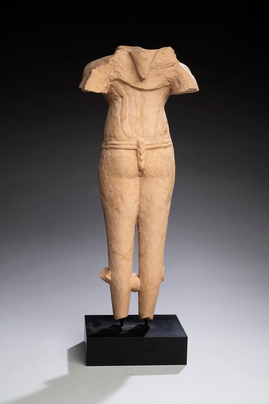 a red sandstone male torso