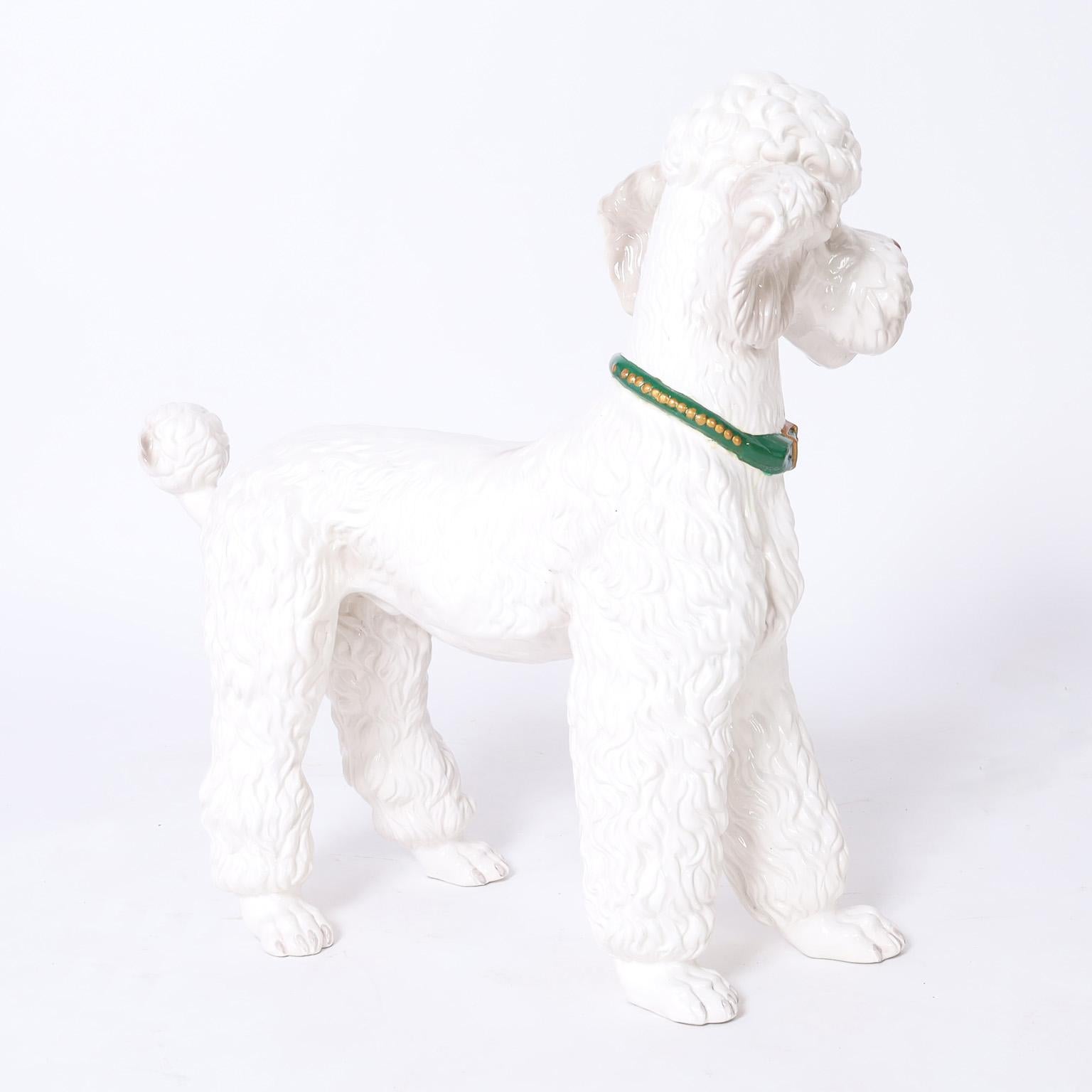 Life size vintage poodle sculpture crafted in ceramic, decorated and glazed with aplomb. Interesting note on the bottom of a paw.