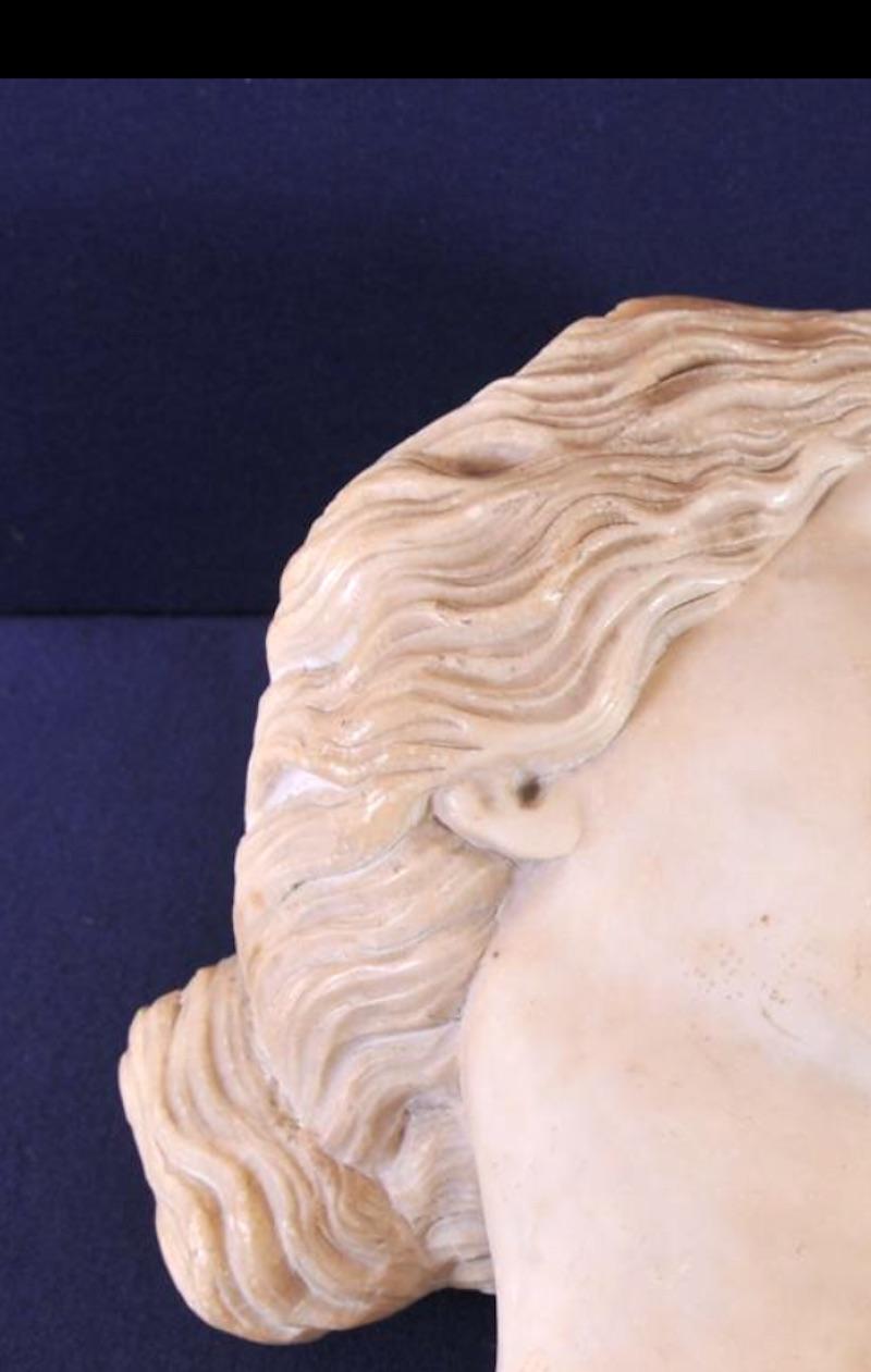 Italian finely carved Alabaster Marble Sculpture of  The Sleeping Ariadne Head.
Inspired from the Roman copy after the Hellenistic Pergamene School original of the 2nd century BC, and one of the most beloved sculptures of antiquity, representing