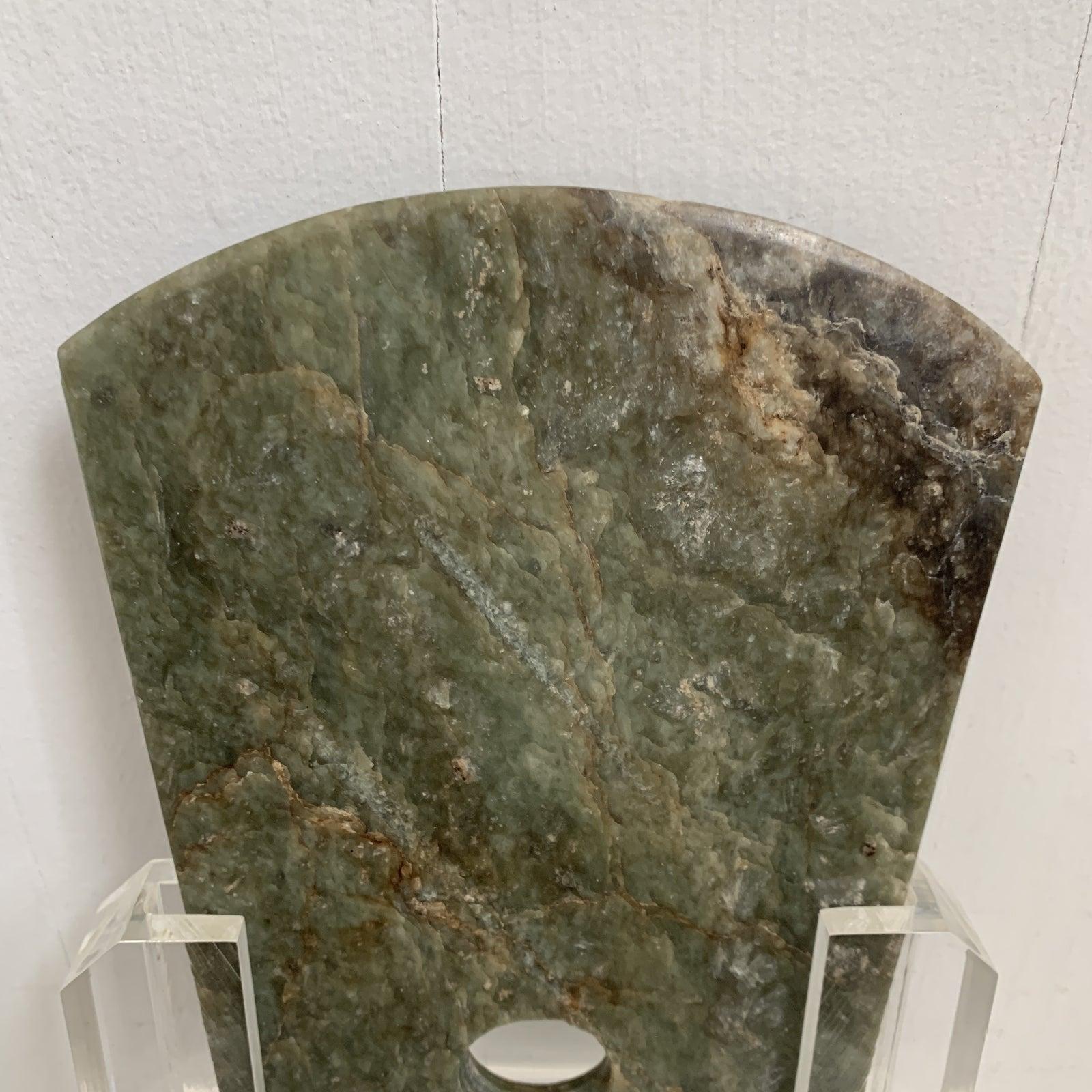  Stone  Ax

Green/Brown Stone with thick custom lucite stand. This peice is being sold on consignment at our gallery. It is really beatiful in person and has no flaws. We cannot confirm the true history with this particular peice. While stunning and