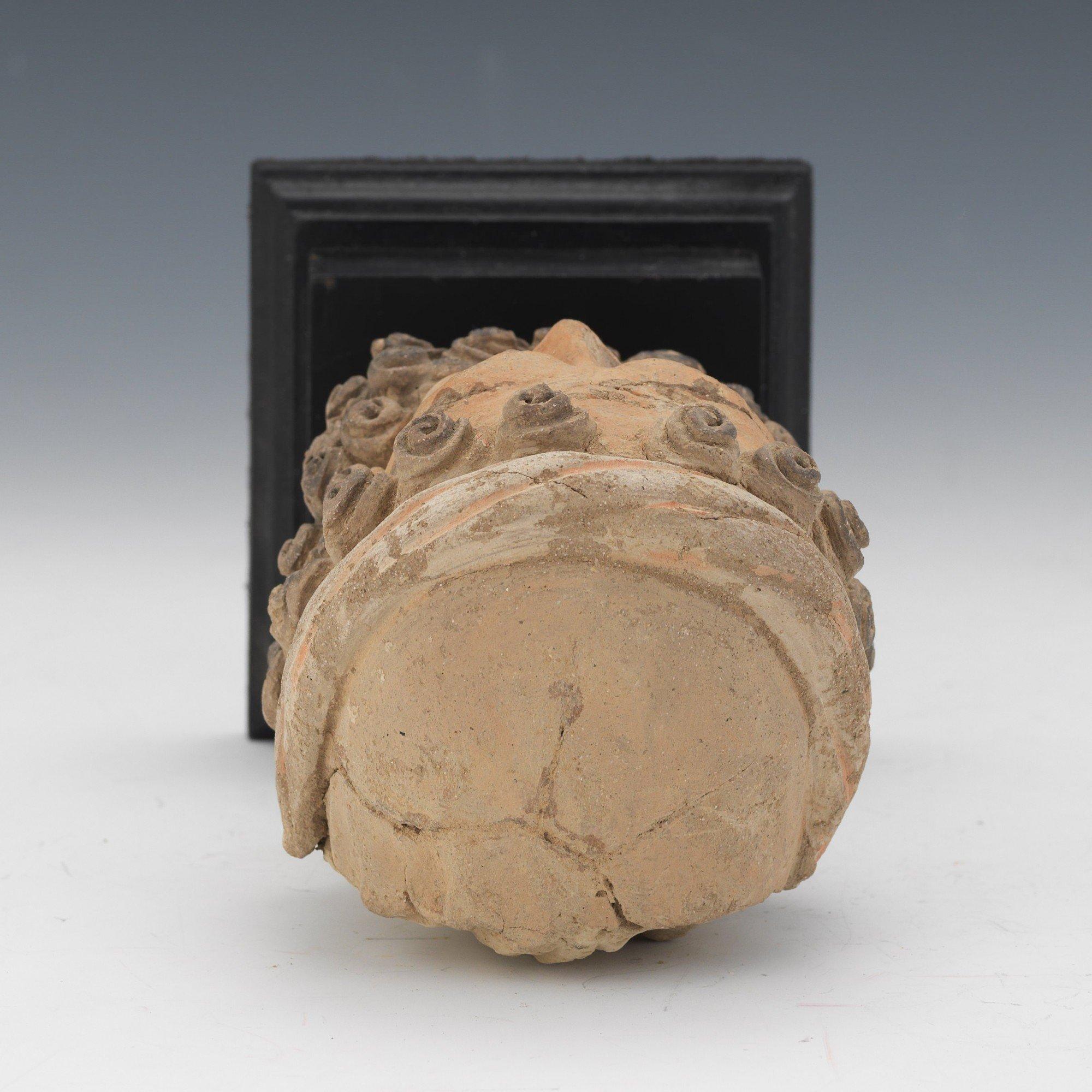 Kashan Terracotta Head of a Bearded Man, c. 1st-2nd Century AD
Terracotta head of a bearded man, with polychrome to the face, lips, and beard, mounted to wood stand.
5.5 in. h. x 3.75 in. w.  x 4 in. d. 
8 in. h. x 4 in. w. x 4 in. d., overall with
