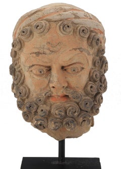 Tête d'homme barbu en terre cuite de Kashan, A.I.-2.C.