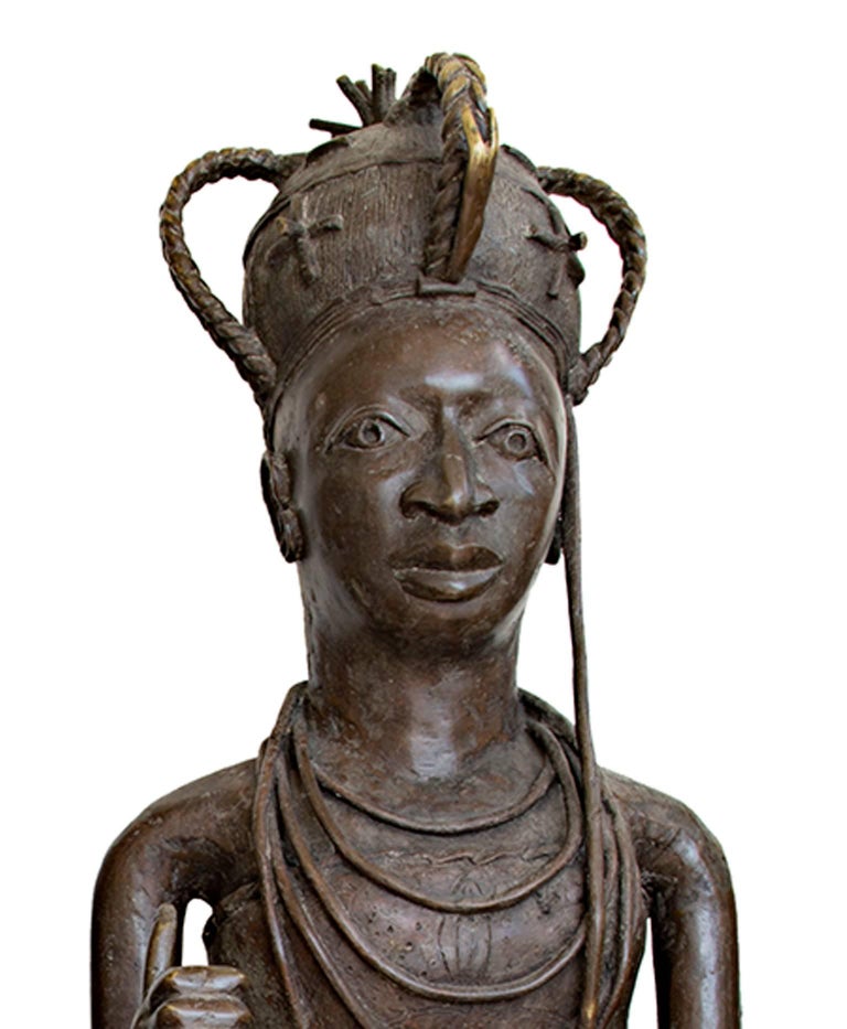 These bronze sculptures were created by an unknown Nigerian artist. They depict the King & Queen of the Benin region. Bronzes such as the Benin King and Queen were done by the Edo people of the Benin Kingdom to show the divinity of the king, or Oba.