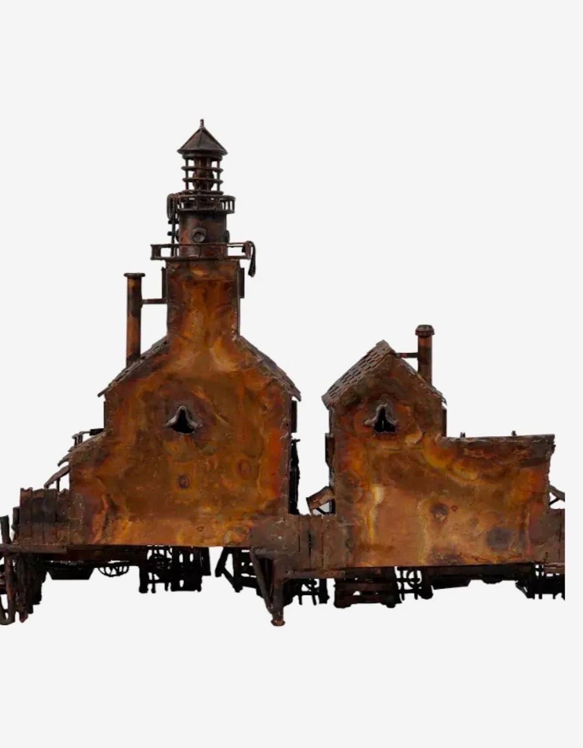A vintage American folk art hand made sculpture architectural model of fishermen's village house and lighthouse tower. 
Made of copper with many unique parts (sailboat paddles, doors, windows, rope, small fishing boat dinghy, store sign, and