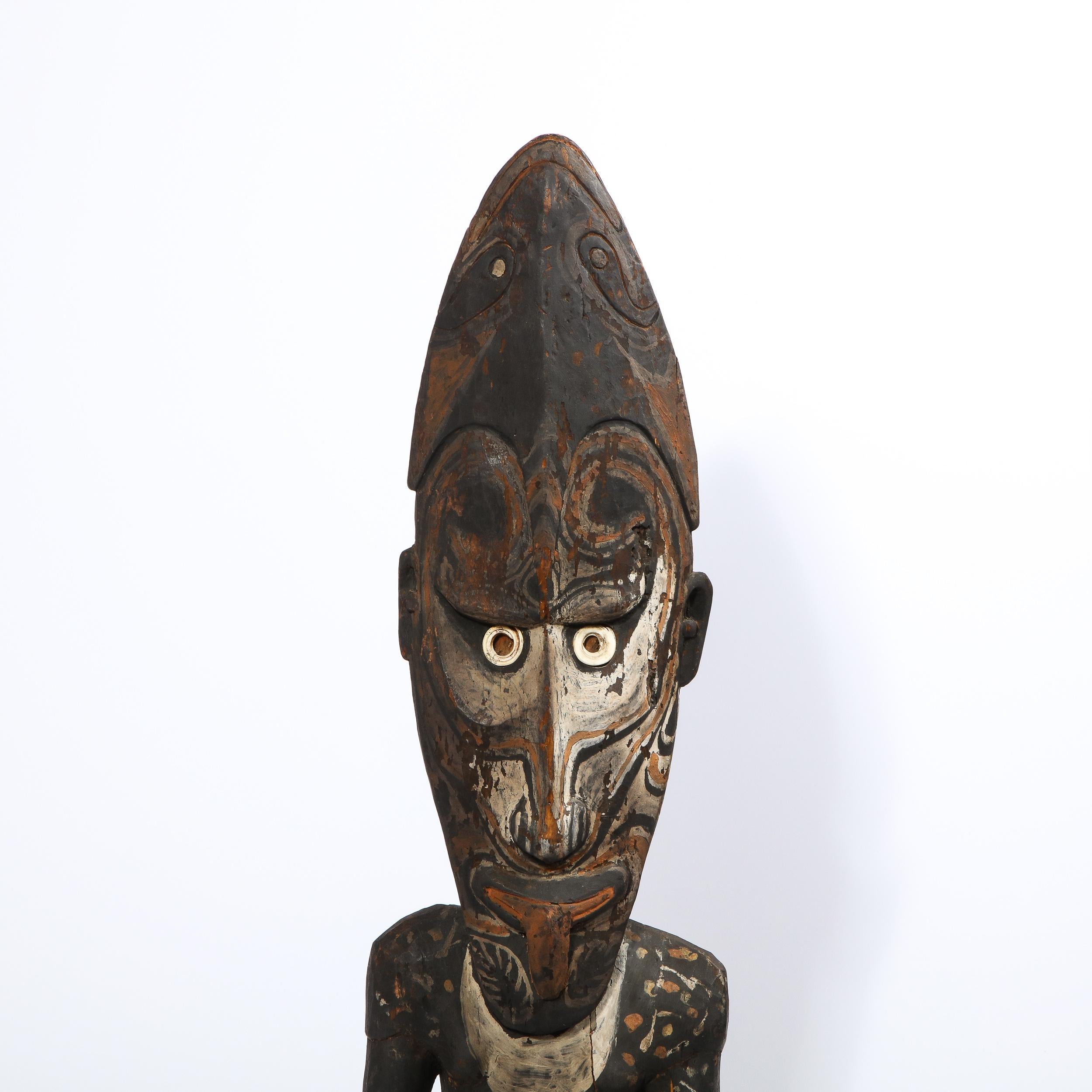 a wooden sculpture of papua