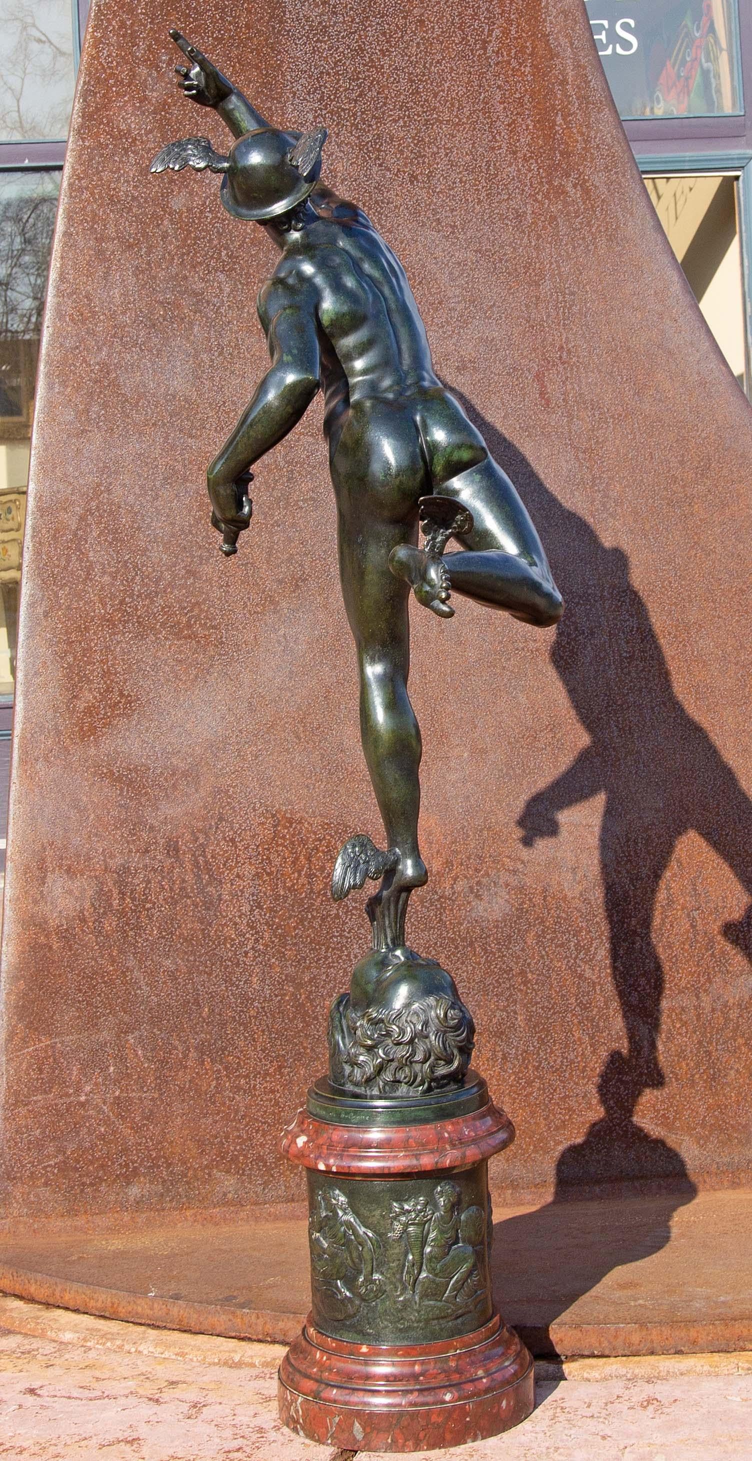 Fine Grand Tour bronze sculpture of mercury flying on the wind after Giambologna. Polished rouge marble and bronze attached base. Green marble pedestal. Inscribed Jean de Bologne ( Giambologna). Over all height 8'7