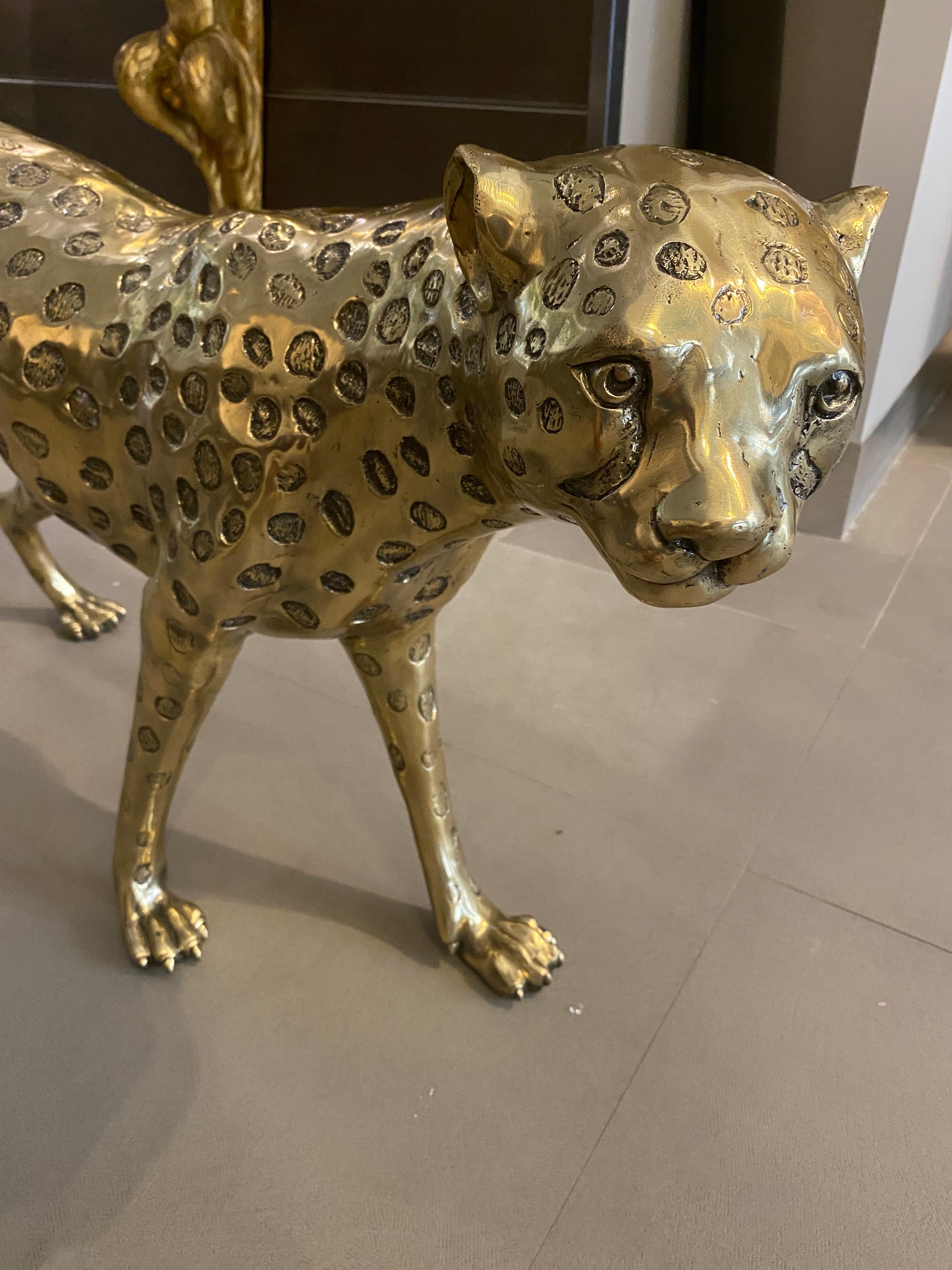 Fantastic gilt brass leopard sculpture . The item will be well-suited to either an indoor or outdoor setting.
