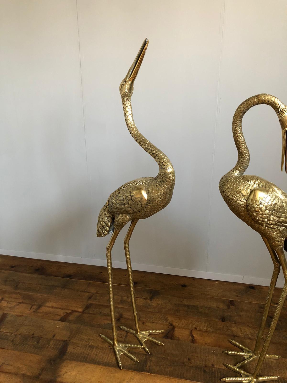 Elegant pair of gilt bronze  heron sculptures . The item will be well-suited to either an indoor or outdoor setting.