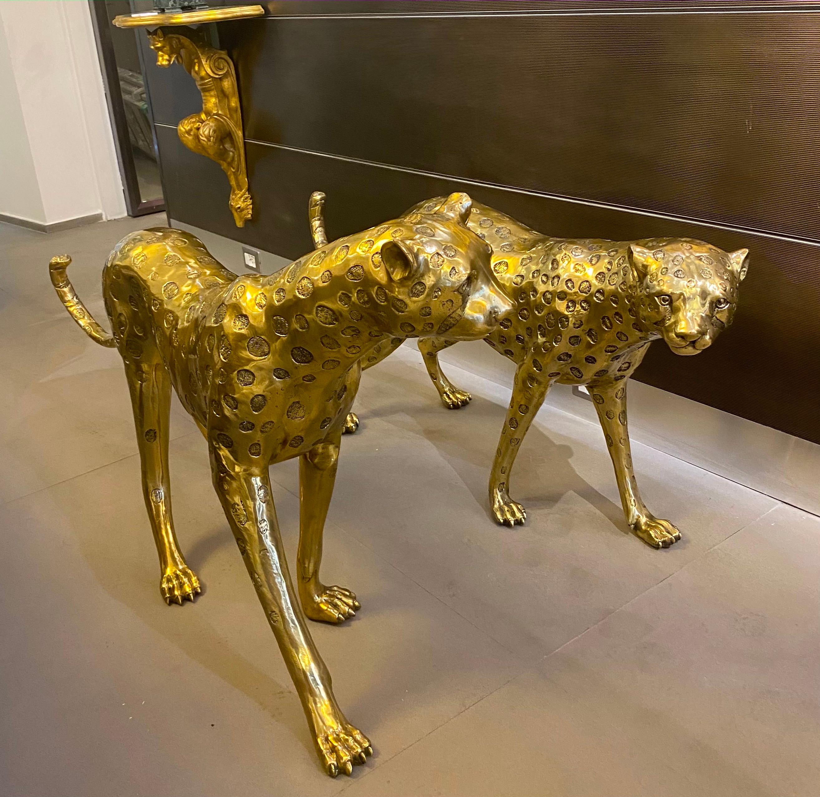 Fantastic pair of gilt bronze leopard sculptures . The item will be well-suited to either an indoor or outdoor setting.