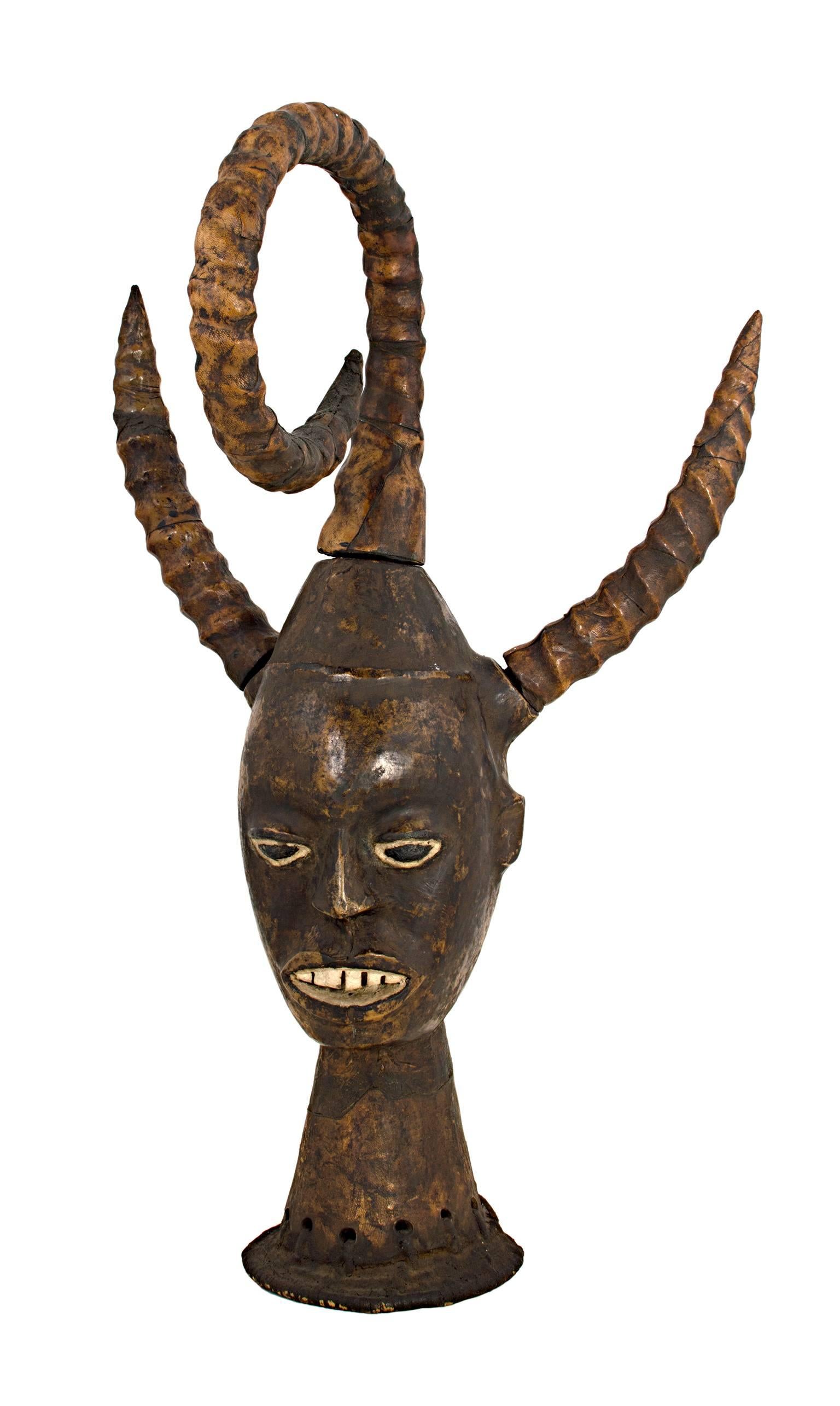 Unknown Figurative Sculpture - "Large Head with Horns - Nigerian, Ekoi People, " Carved Wood created circa 1950
