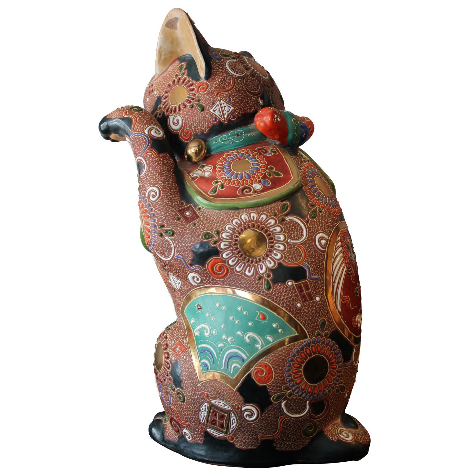 Ornate porcelain Maneki Neko or popularly known as Lucky Cat. The beckoning cat is a sign of wealth in Japanese and Chinses culture. The “mori” style refers to raised loops and other decorative motifs applied by squeezing a tube of slip onto the