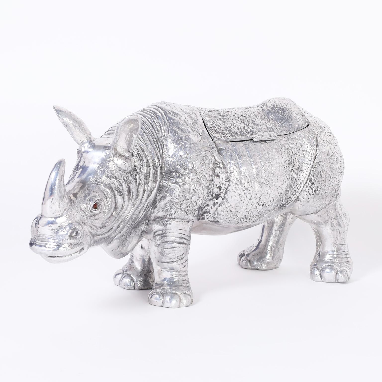 Striking mid-century sculpture of a Rhinoceros cast in aluminum with its iconic profile and lidded storage compartment.