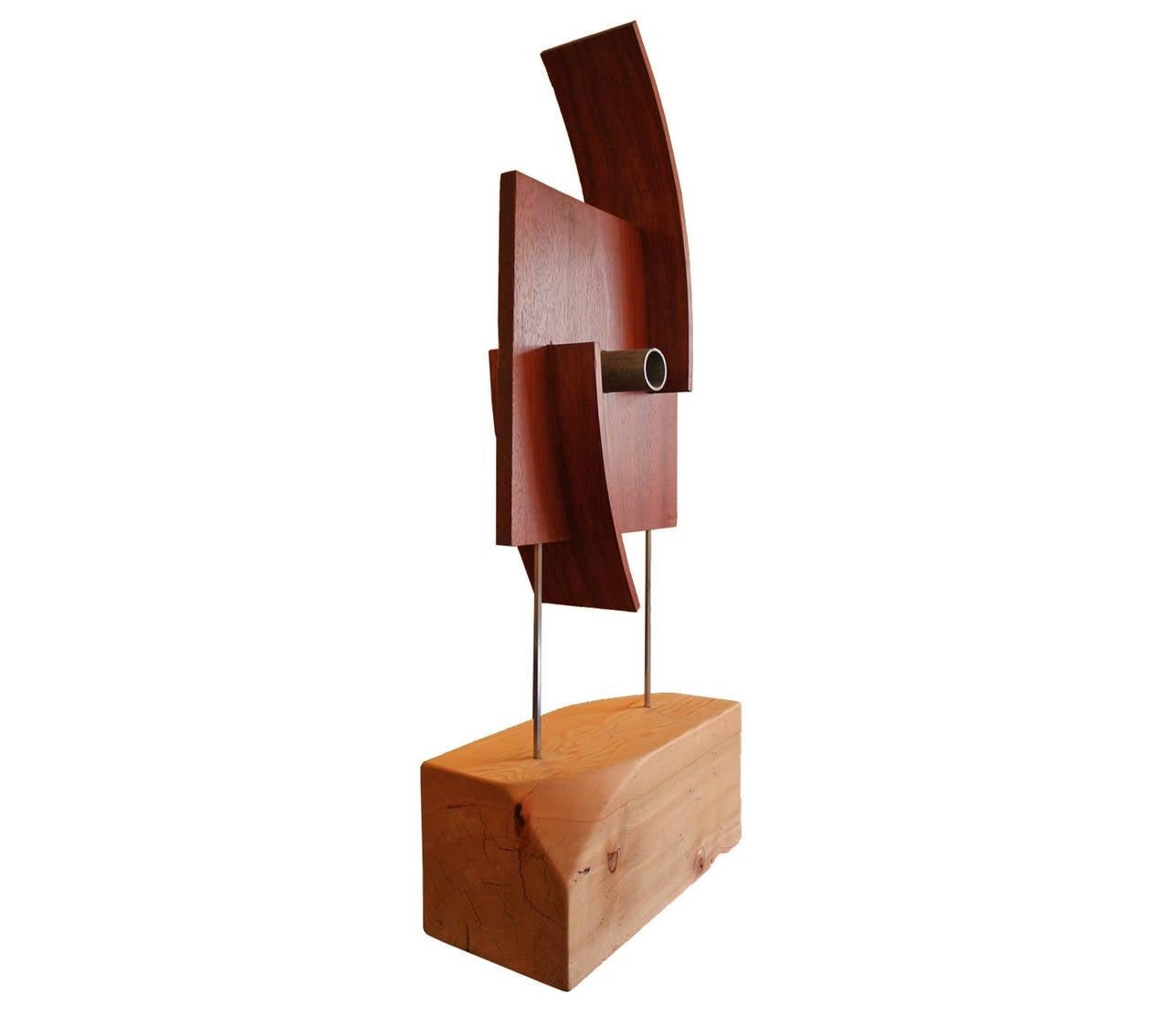 Unique industrial wooden sculpture made in a modern organic style. The wood is of high quality and the top piece is detectable from the base.