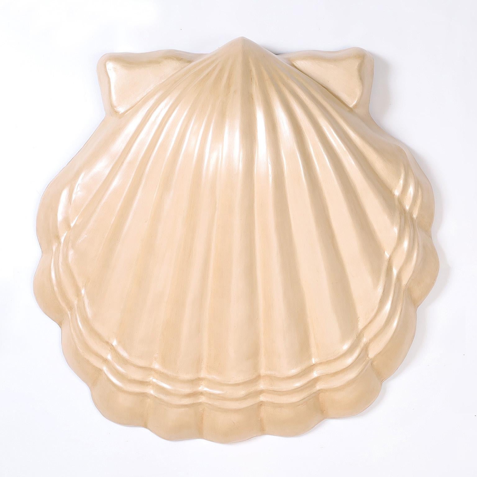 Large mid century seashell wall sculpture crafted in fiberglass in its iconic form with a pearlized lacquered finish.