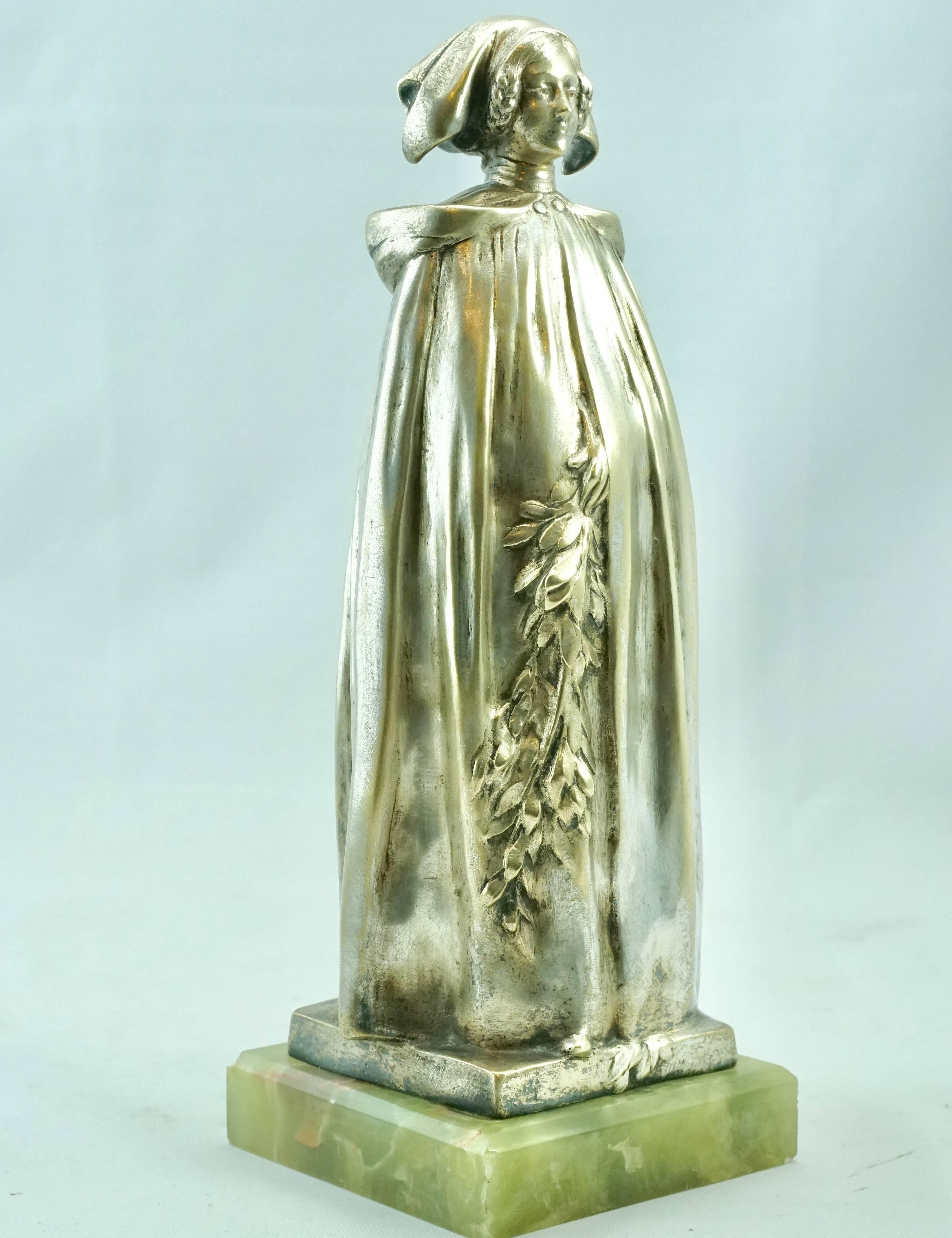 L'alsacienne Or Bretonne aux Rameau silver overlay patina by Leo Laporte Blairsy (French, 1867-1923). Depicting a woman in robe holding a garnet of flowers with a L'alsacienne or Bretonne bonnet hat. Bronze on original onyx stone base.

Measure: