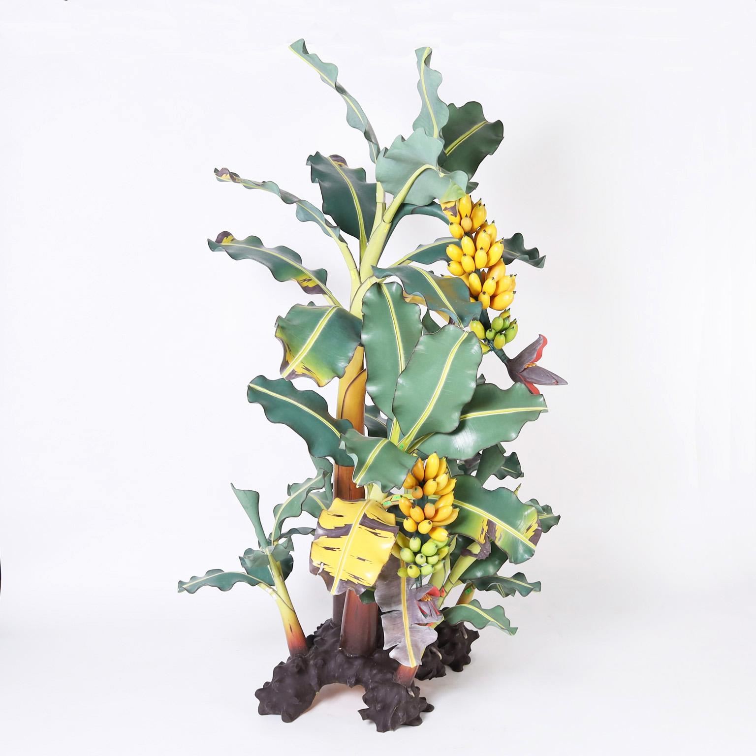 Rare and remarkable life size Indonesian banana tree sculpture ambitiously crafted in wood and painted with eye catching realism. Detachable leaves and fruit for easy shipping.  
